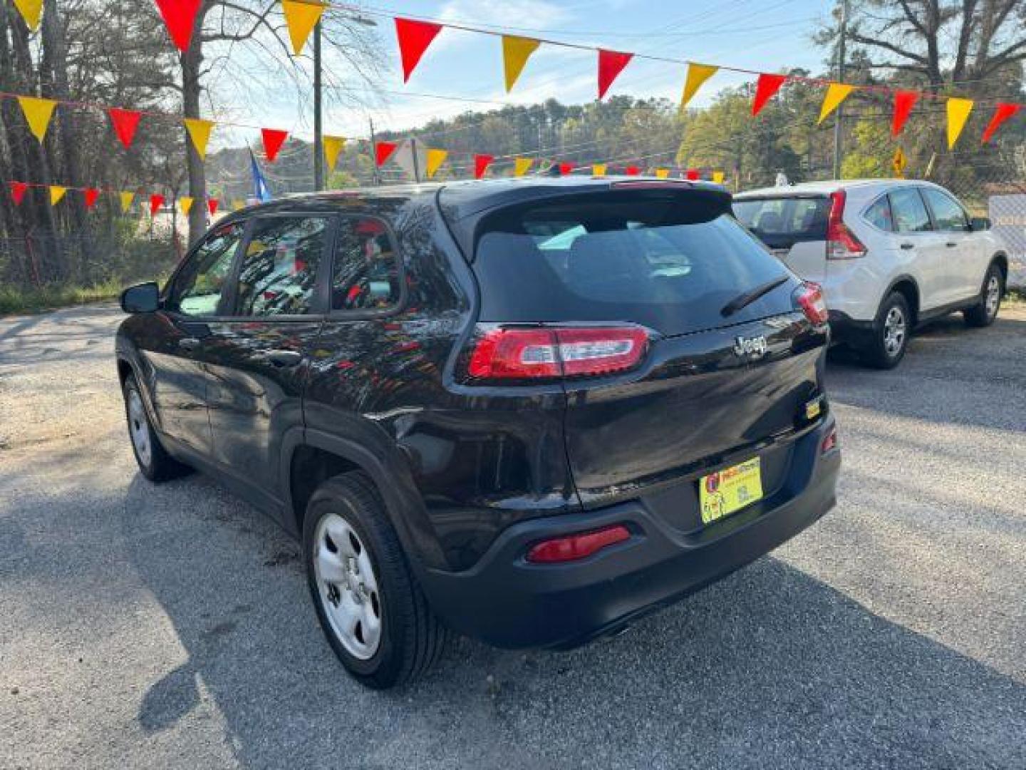 2014 Black Jeep Cherokee Sport FWD (1C4PJLAB7EW) with an 2.4L L4 DOHC 16V engine, 9-Speed Automatic transmission, located at 1806 Veterans Memorial Hwy SW, Austell, GA, 30168, (770) 944-9558, 33.817959, -84.606987 - Photo#5