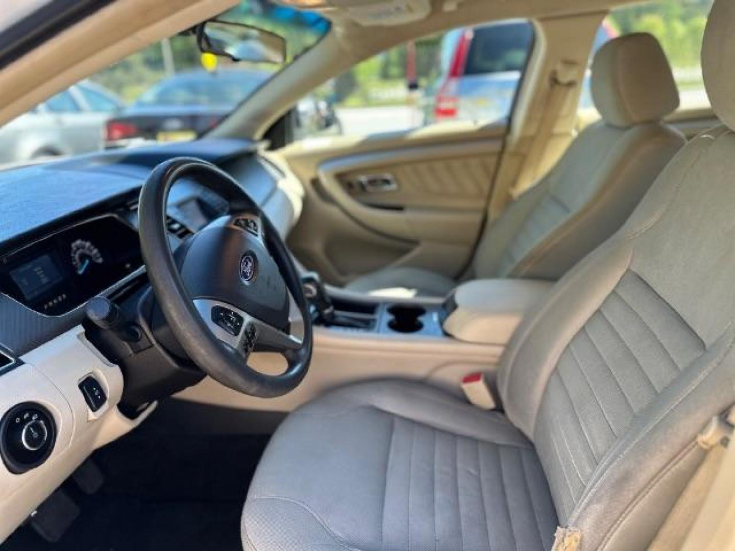 2016 WHITE Ford Taurus SE FWD (1FAHP2D88GG) with an 3.5L V6 DOHC 24V engine, 6-Speed Automatic transmission, located at 1806 Veterans Memorial Hwy SW, Austell, GA, 30168, (770) 944-9558, 33.817959, -84.606987 - Photo#8