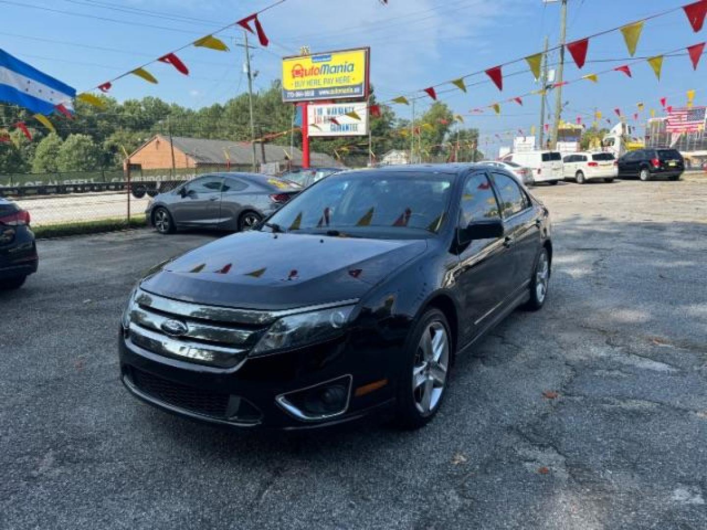 2012 BLACK Ford Fusion SPORT (3FAHP0KC3CR) with an 3.5L V6 DOHC 24V engine, 5-Speed Automatic transmission, located at 1806 Veterans Memorial Hwy SW, Austell, GA, 30168, (770) 944-9558, 33.817959, -84.606987 - Photo#0