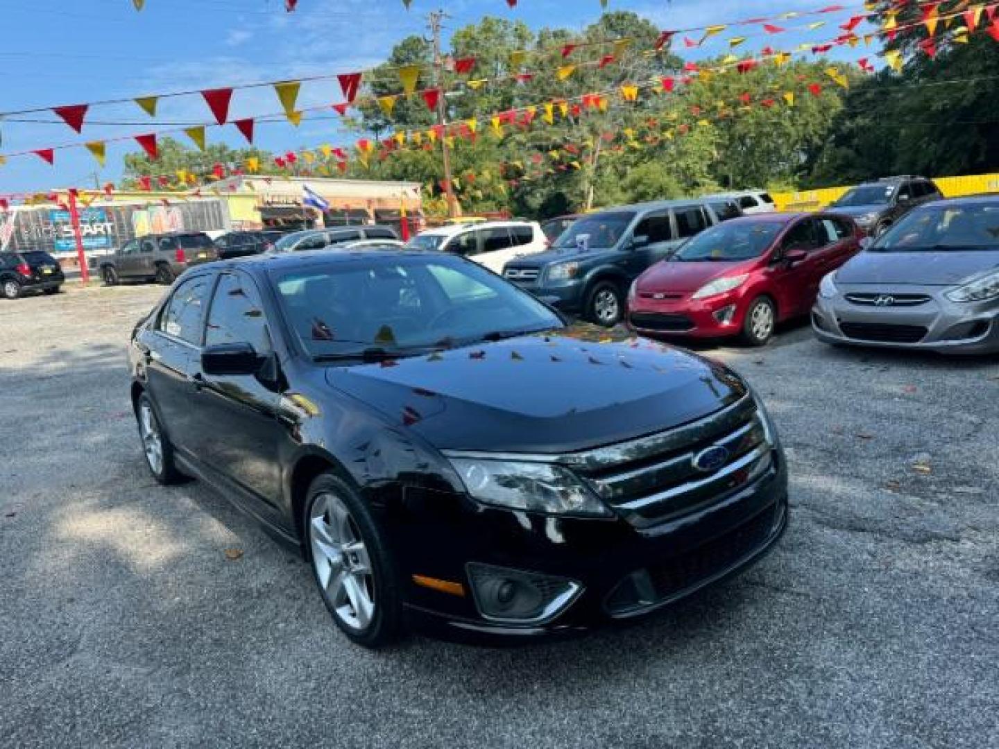 2012 BLACK Ford Fusion SPORT (3FAHP0KC3CR) with an 3.5L V6 DOHC 24V engine, 5-Speed Automatic transmission, located at 1806 Veterans Memorial Hwy SW, Austell, GA, 30168, (770) 944-9558, 33.817959, -84.606987 - Photo#2