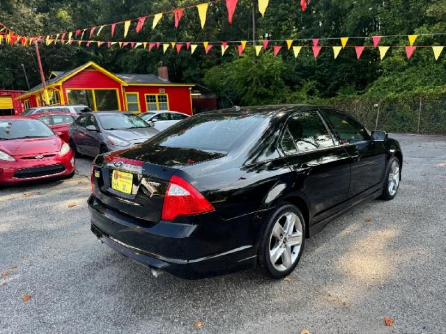 2012 BLACK Ford Fusion SPORT (3FAHP0KC3CR) with an 3.5L V6 DOHC 24V engine, 5-Speed Automatic transmission, located at 1806 Veterans Memorial Hwy SW, Austell, GA, 30168, (770) 944-9558, 33.817959, -84.606987 - Photo#4