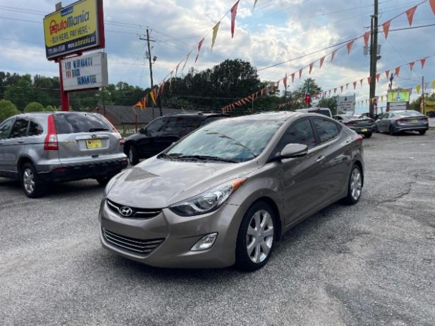 2013 Brown Hyundai Elantra Limited (5NPDH4AE1DH) with an 1.8L L4 DOHC 16V engine, 6-Speed Automatic transmission, located at 1806 Veterans Memorial Hwy SW, Austell, GA, 30168, (770) 944-9558, 33.817959, -84.606987 - Photo#0