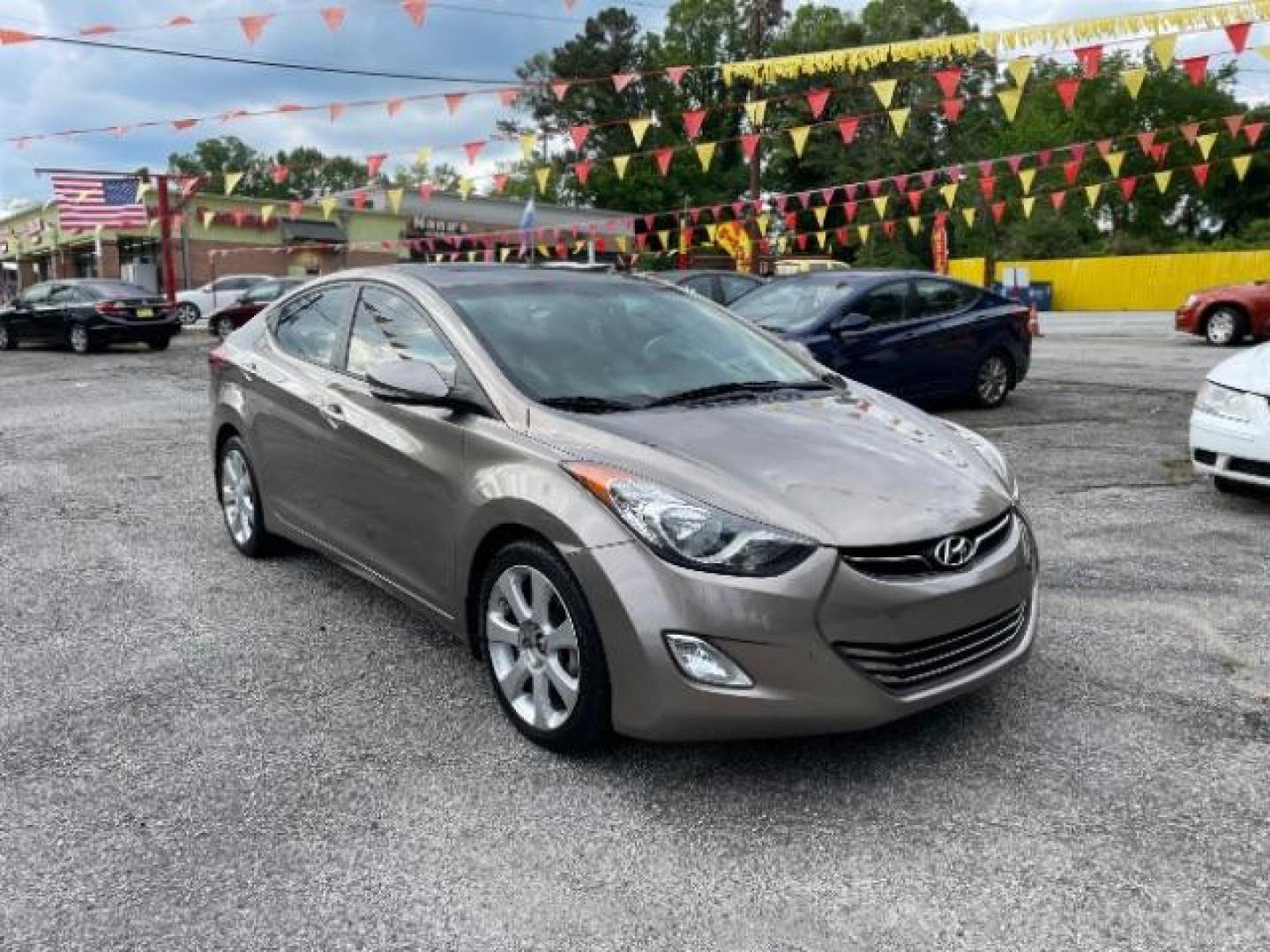 2013 Brown Hyundai Elantra Limited (5NPDH4AE1DH) with an 1.8L L4 DOHC 16V engine, 6-Speed Automatic transmission, located at 1806 Veterans Memorial Hwy SW, Austell, GA, 30168, (770) 944-9558, 33.817959, -84.606987 - Photo#1