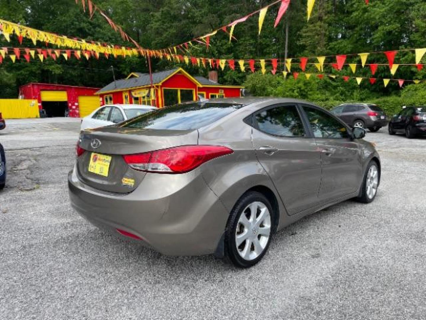 2013 Brown Hyundai Elantra Limited (5NPDH4AE1DH) with an 1.8L L4 DOHC 16V engine, 6-Speed Automatic transmission, located at 1806 Veterans Memorial Hwy SW, Austell, GA, 30168, (770) 944-9558, 33.817959, -84.606987 - Photo#3