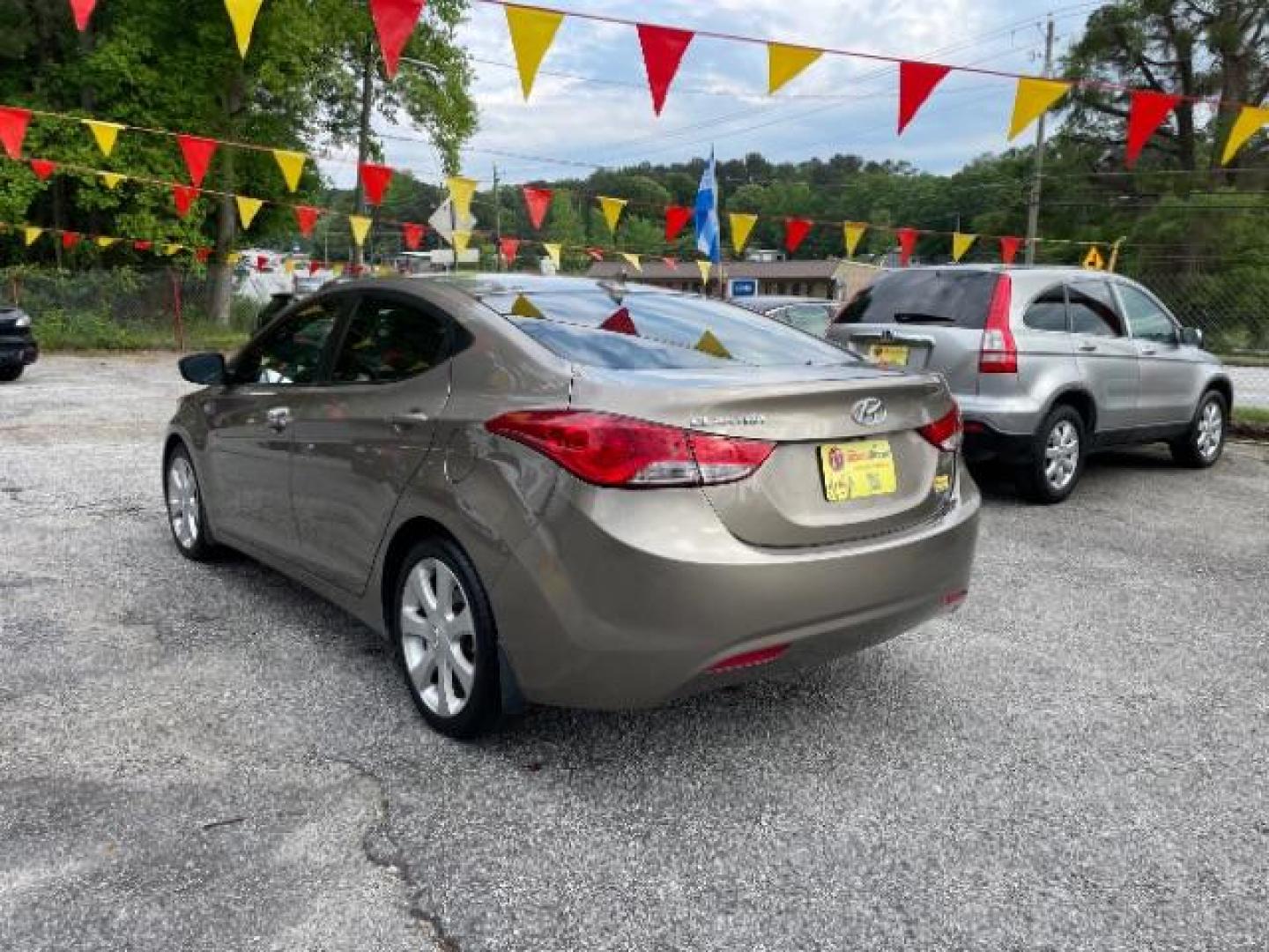 2013 Brown Hyundai Elantra Limited (5NPDH4AE1DH) with an 1.8L L4 DOHC 16V engine, 6-Speed Automatic transmission, located at 1806 Veterans Memorial Hwy SW, Austell, GA, 30168, (770) 944-9558, 33.817959, -84.606987 - Photo#5