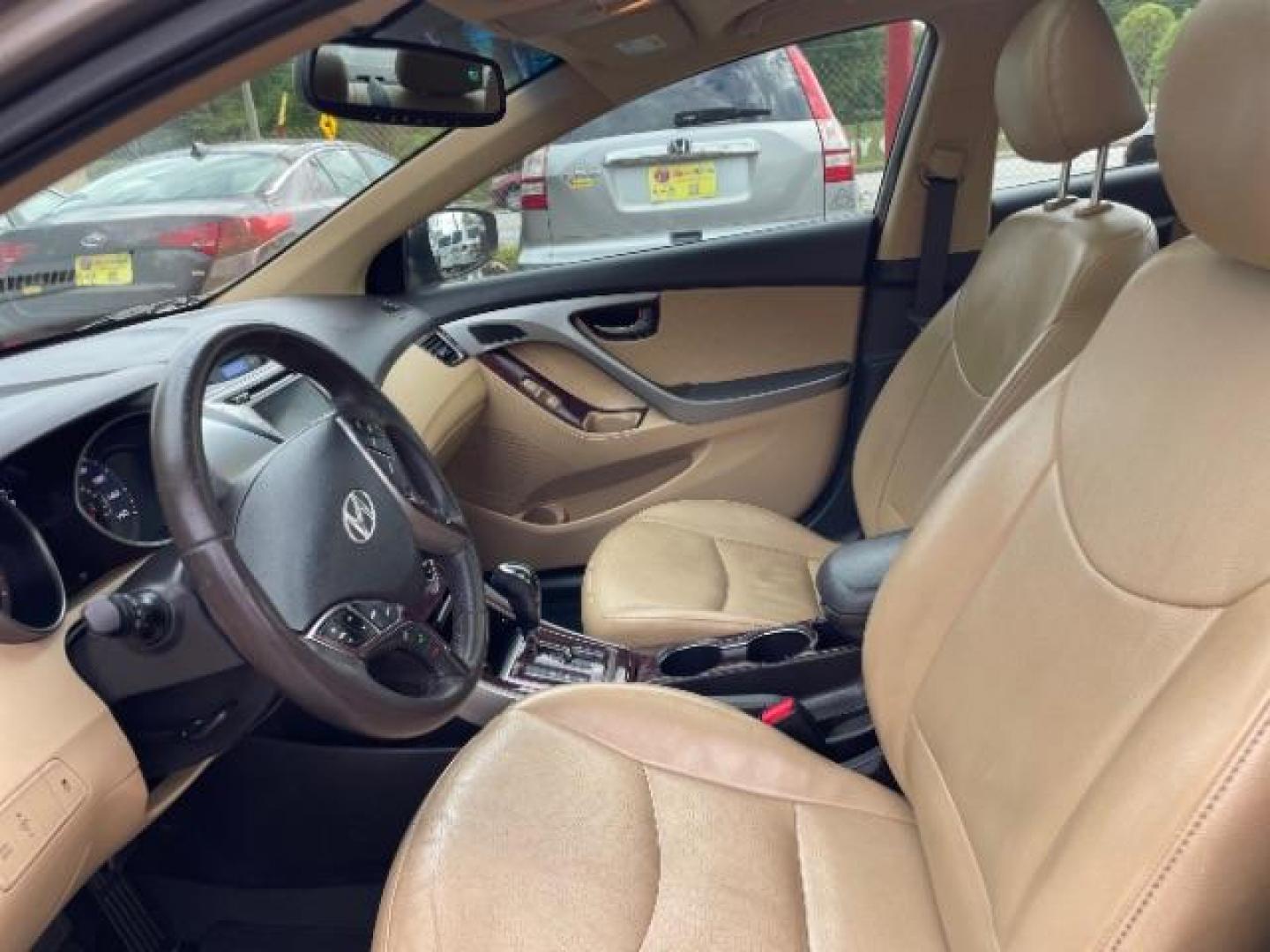 2013 Brown Hyundai Elantra Limited (5NPDH4AE1DH) with an 1.8L L4 DOHC 16V engine, 6-Speed Automatic transmission, located at 1806 Veterans Memorial Hwy SW, Austell, GA, 30168, (770) 944-9558, 33.817959, -84.606987 - Photo#7