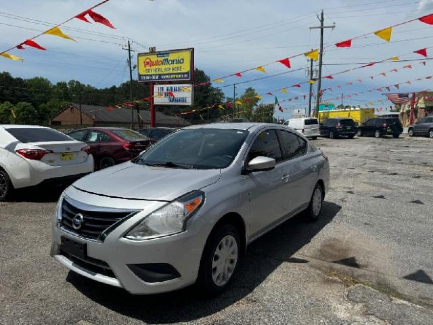 2016 Silver Nissan Versa 1.6 SV Sedan (3N1CN7AP9GL) with an 1.6L L4 DOHC 16V engine, Continuously Variable Transmission transmission, located at 1806 Veterans Memorial Hwy SW, Austell, GA, 30168, (770) 944-9558, 33.817959, -84.606987 - Photo#0