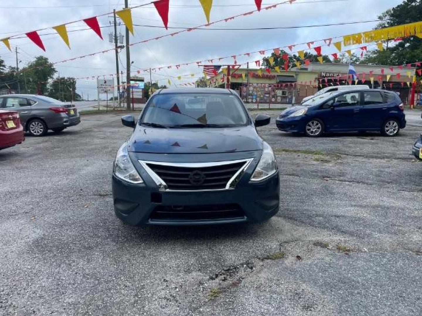 2017 Blue Nissan Versa 1.6 SV Sedan (3N1CN7AP4HL) with an 1.6L L4 DOHC 16V engine, Continuously Variable Transmission transmission, located at 1806 Veterans Memorial Hwy SW, Austell, GA, 30168, (770) 944-9558, 33.817959, -84.606987 - Photo#1