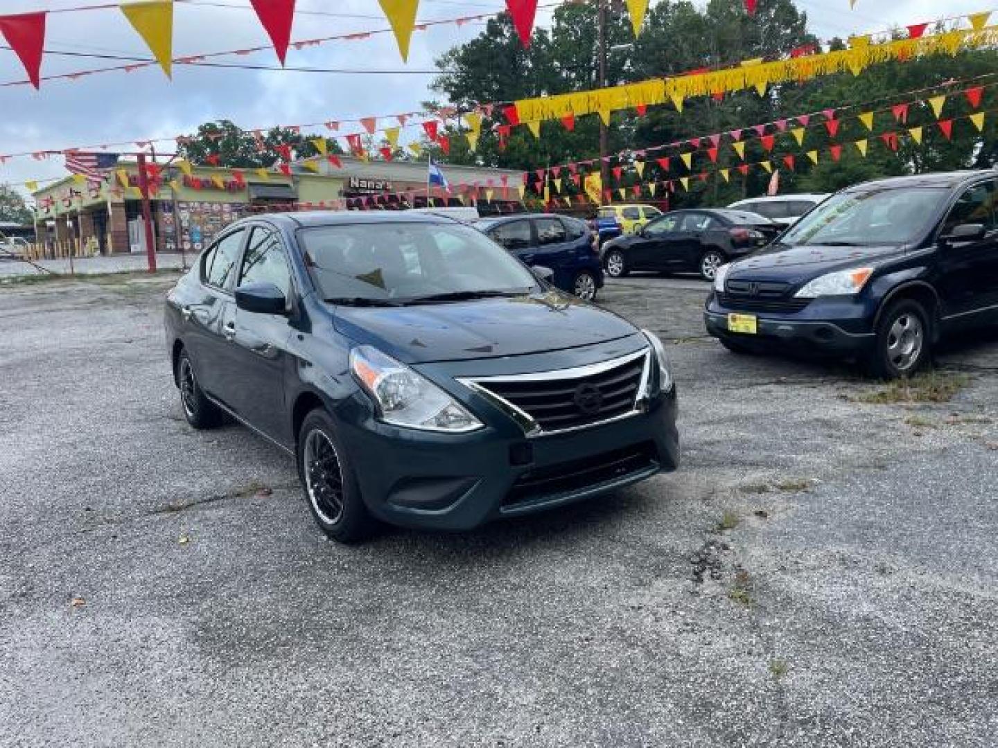 2017 Blue Nissan Versa 1.6 SV Sedan (3N1CN7AP4HL) with an 1.6L L4 DOHC 16V engine, Continuously Variable Transmission transmission, located at 1806 Veterans Memorial Hwy SW, Austell, GA, 30168, (770) 944-9558, 33.817959, -84.606987 - Photo#2