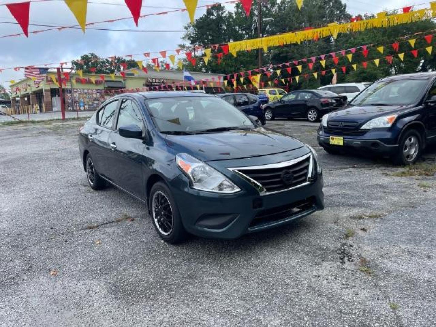 2017 Blue Nissan Versa 1.6 SV Sedan (3N1CN7AP4HL) with an 1.6L L4 DOHC 16V engine, Continuously Variable Transmission transmission, located at 1806 Veterans Memorial Hwy SW, Austell, GA, 30168, (770) 944-9558, 33.817959, -84.606987 - Photo#3