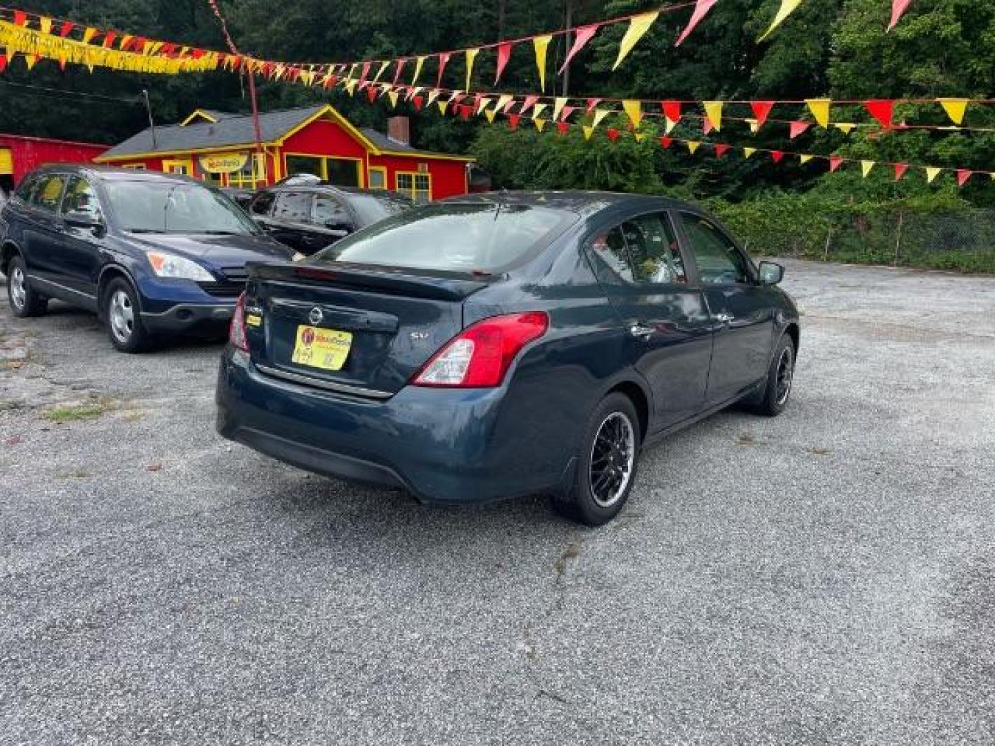 2017 Blue Nissan Versa 1.6 SV Sedan (3N1CN7AP4HL) with an 1.6L L4 DOHC 16V engine, Continuously Variable Transmission transmission, located at 1806 Veterans Memorial Hwy SW, Austell, GA, 30168, (770) 944-9558, 33.817959, -84.606987 - Photo#4