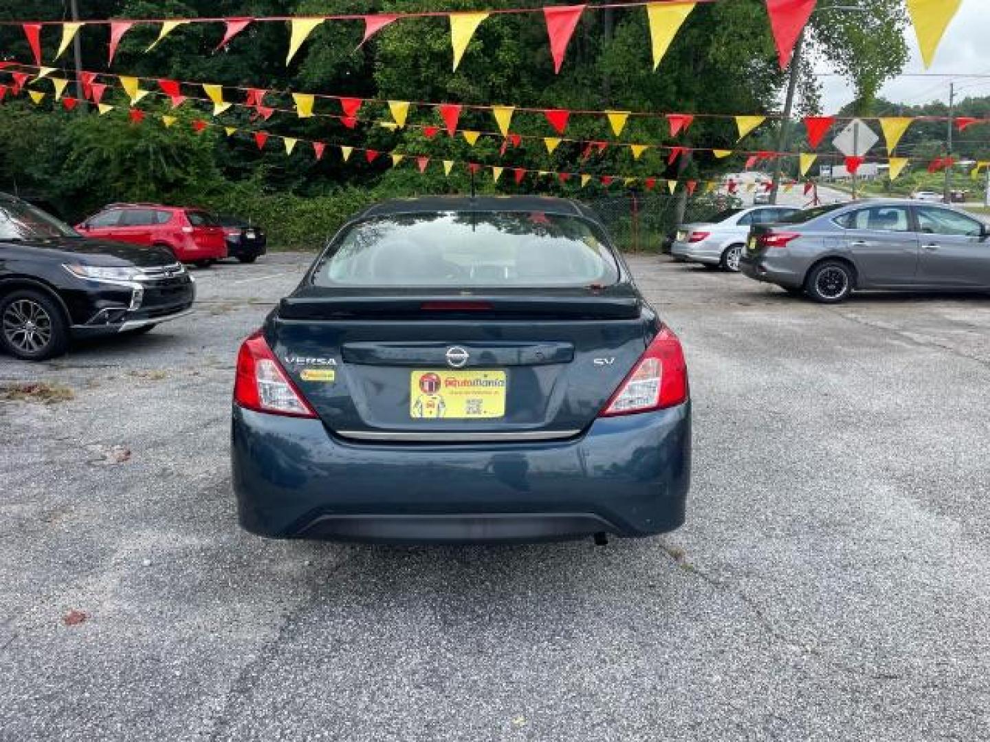 2017 Blue Nissan Versa 1.6 SV Sedan (3N1CN7AP4HL) with an 1.6L L4 DOHC 16V engine, Continuously Variable Transmission transmission, located at 1806 Veterans Memorial Hwy SW, Austell, GA, 30168, (770) 944-9558, 33.817959, -84.606987 - Photo#5