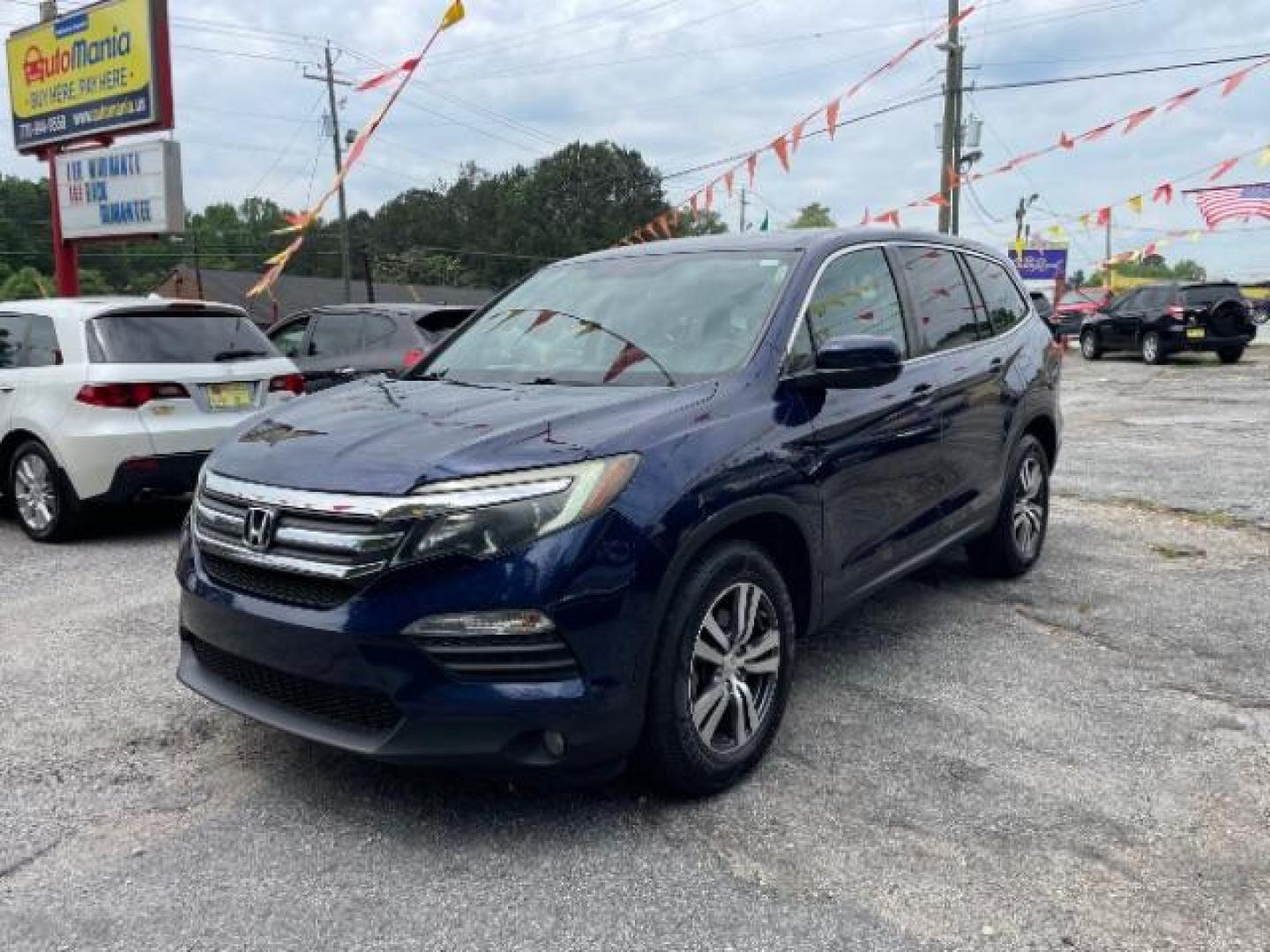 2016 Blue Honda Pilot EX 2WD (5FNYF5H35GB) with an 3.5L V6 SOHC 24V engine, 6-Speed Automatic transmission, located at 1806 Veterans Memorial Hwy SW, Austell, GA, 30168, (770) 944-9558, 33.817959, -84.606987 - Photo#1