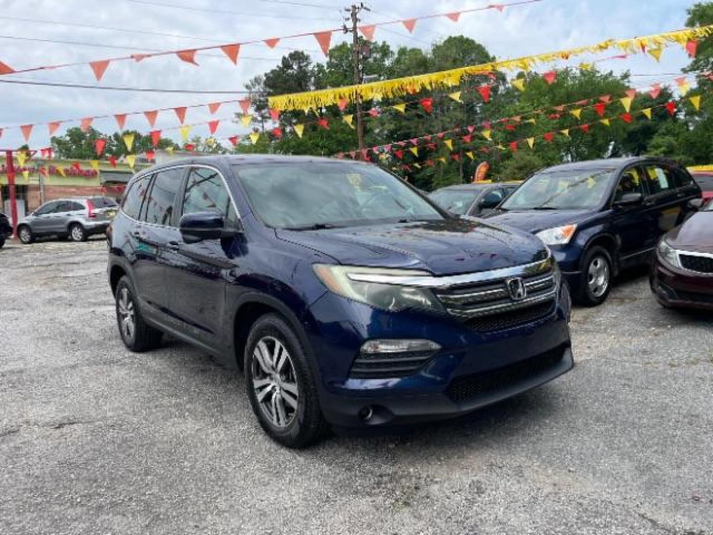 2016 Blue Honda Pilot EX 2WD (5FNYF5H35GB) with an 3.5L V6 SOHC 24V engine, 6-Speed Automatic transmission, located at 1806 Veterans Memorial Hwy SW, Austell, GA, 30168, (770) 944-9558, 33.817959, -84.606987 - Photo#2