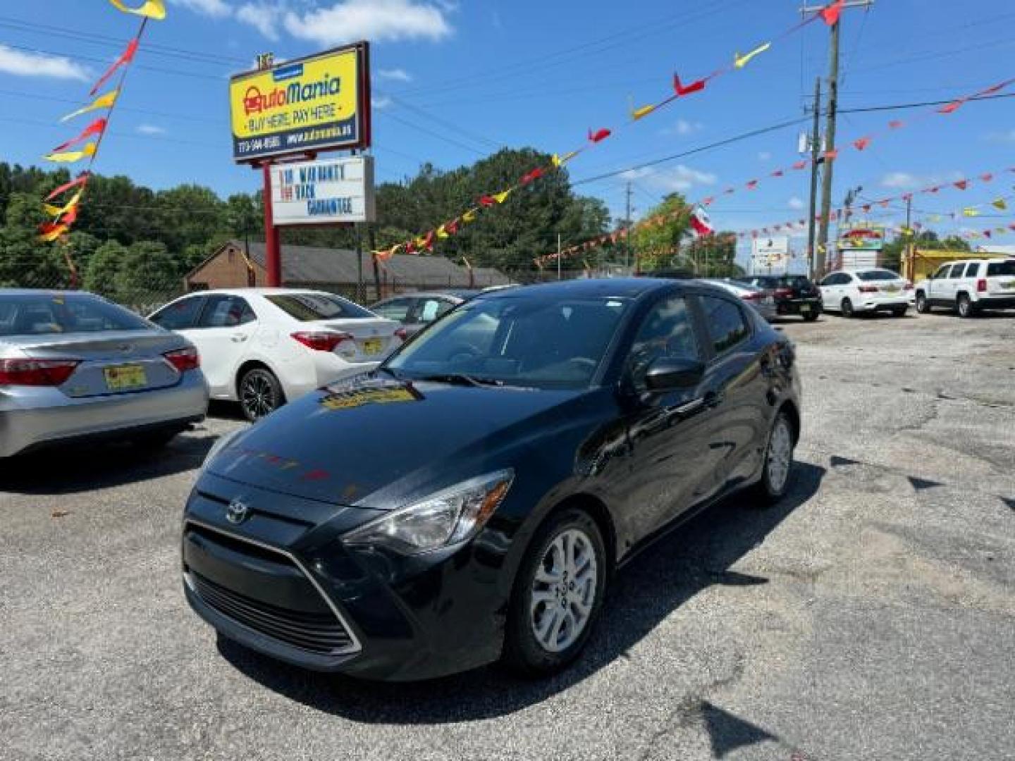 2018 Black Toyota Yaris iA 6A (3MYDLBYVXJY) with an 1.5L L4 DOHC 16V engine, 6-Speed Automatic transmission, located at 1806 Veterans Memorial Hwy SW, Austell, GA, 30168, (770) 944-9558, 33.817959, -84.606987 - Photo#0