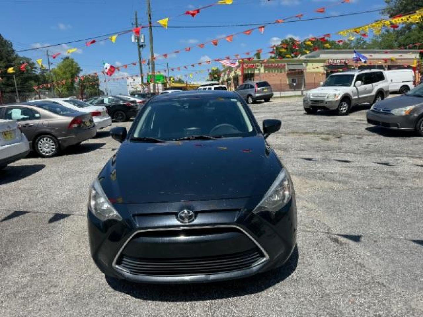 2018 Black Toyota Yaris iA 6A (3MYDLBYVXJY) with an 1.5L L4 DOHC 16V engine, 6-Speed Automatic transmission, located at 1806 Veterans Memorial Hwy SW, Austell, GA, 30168, (770) 944-9558, 33.817959, -84.606987 - Photo#1