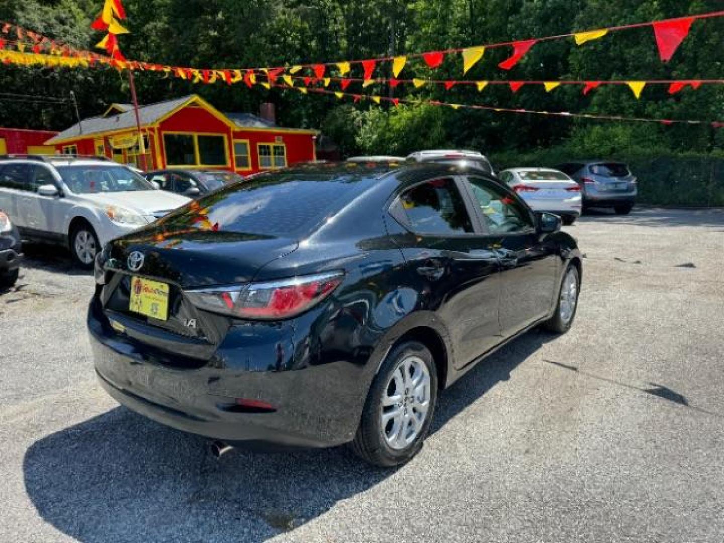 2018 Black Toyota Yaris iA 6A (3MYDLBYVXJY) with an 1.5L L4 DOHC 16V engine, 6-Speed Automatic transmission, located at 1806 Veterans Memorial Hwy SW, Austell, GA, 30168, (770) 944-9558, 33.817959, -84.606987 - Photo#2