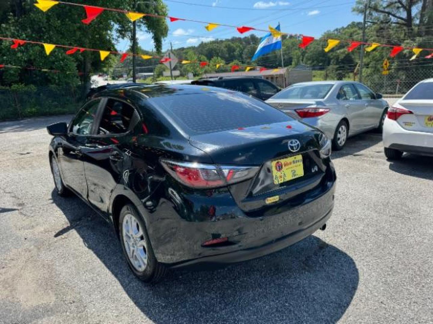 2018 Black Toyota Yaris iA 6A (3MYDLBYVXJY) with an 1.5L L4 DOHC 16V engine, 6-Speed Automatic transmission, located at 1806 Veterans Memorial Hwy SW, Austell, GA, 30168, (770) 944-9558, 33.817959, -84.606987 - Photo#5