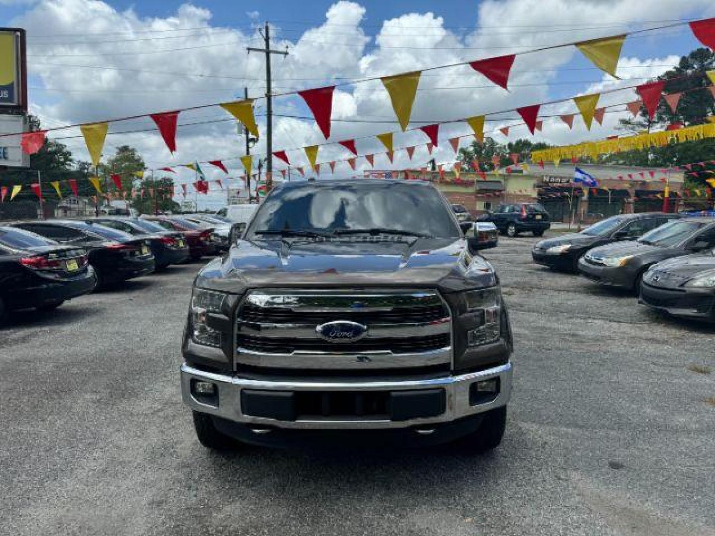 2016 Brown Ford F-150 Lariat SuperCrew 6.5-ft. Bed 4WD (1FTFW1EG9GF) with an 3.5 V6 engine, 6-Speed Automatic transmission, located at 1806 Veterans Memorial Hwy SW, Austell, GA, 30168, (770) 944-9558, 33.817959, -84.606987 - Photo#1