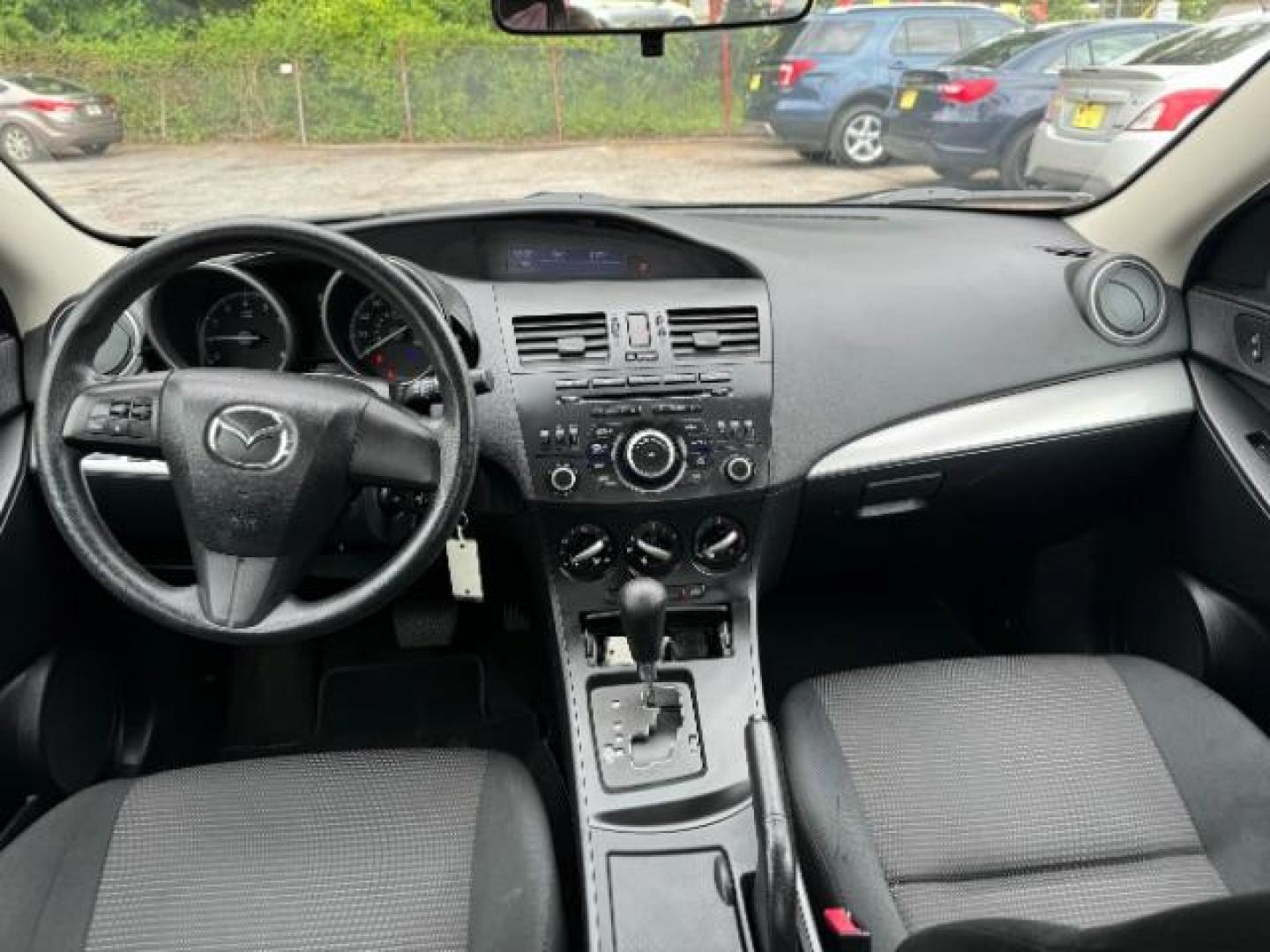 2013 Black Mazda MAZDA3 i SV AT 4-Door (JM1BL1TF0D1) with an 2.0L L4 DOHC 16V engine, 5-Speed Automatic transmission, located at 1806 Veterans Memorial Hwy SW, Austell, GA, 30168, (770) 944-9558, 33.817959, -84.606987 - Photo#12