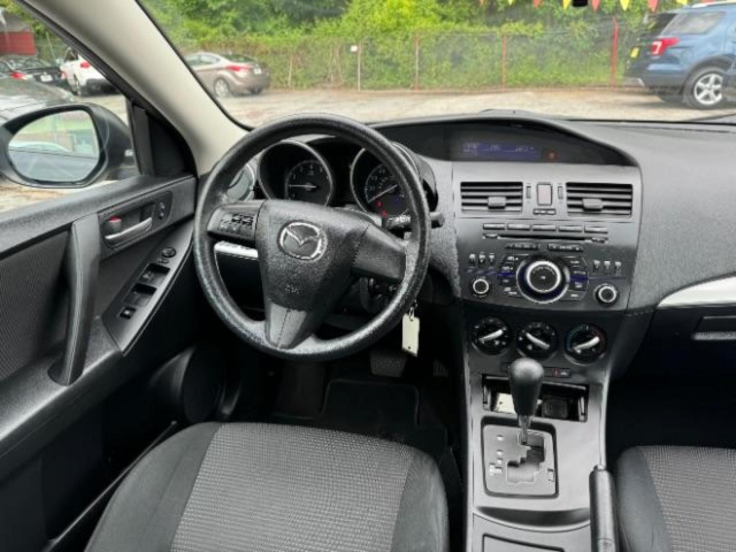 2013 Black Mazda MAZDA3 i SV AT 4-Door (JM1BL1TF0D1) with an 2.0L L4 DOHC 16V engine, 5-Speed Automatic transmission, located at 1806 Veterans Memorial Hwy SW, Austell, GA, 30168, (770) 944-9558, 33.817959, -84.606987 - Photo#13