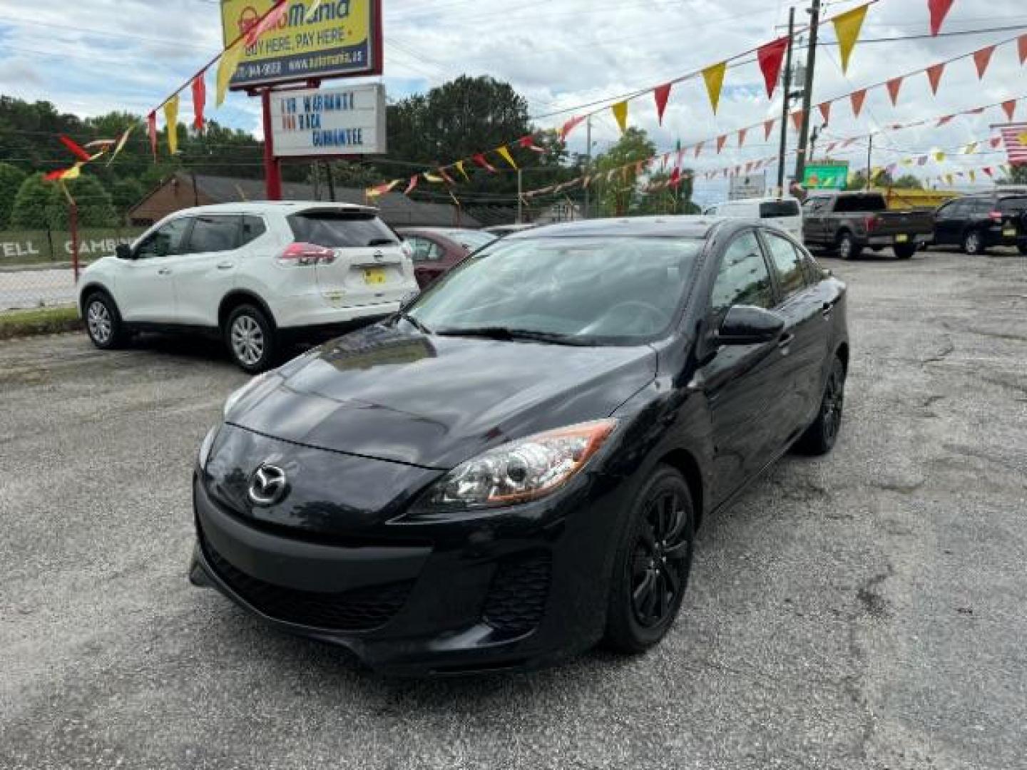 2013 Black Mazda MAZDA3 i SV AT 4-Door (JM1BL1TF0D1) with an 2.0L L4 DOHC 16V engine, 5-Speed Automatic transmission, located at 1806 Veterans Memorial Hwy SW, Austell, GA, 30168, (770) 944-9558, 33.817959, -84.606987 - Photo#1