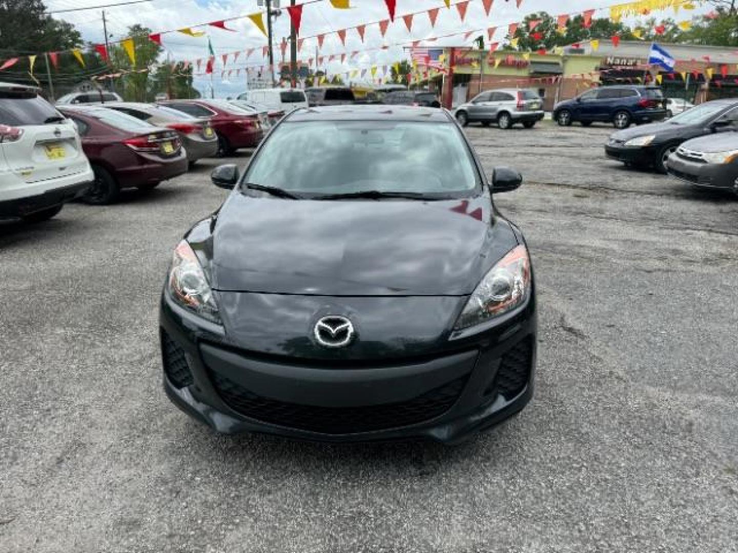 2013 Black Mazda MAZDA3 i SV AT 4-Door (JM1BL1TF0D1) with an 2.0L L4 DOHC 16V engine, 5-Speed Automatic transmission, located at 1806 Veterans Memorial Hwy SW, Austell, GA, 30168, (770) 944-9558, 33.817959, -84.606987 - Photo#2