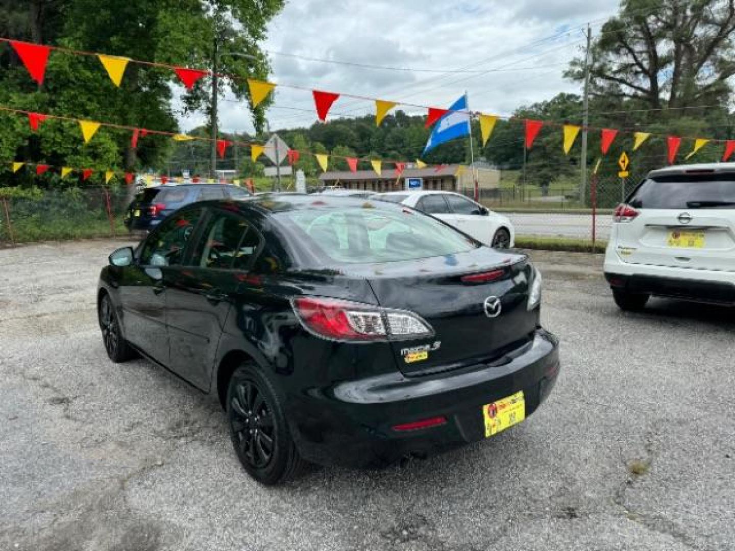 2013 Black Mazda MAZDA3 i SV AT 4-Door (JM1BL1TF0D1) with an 2.0L L4 DOHC 16V engine, 5-Speed Automatic transmission, located at 1806 Veterans Memorial Hwy SW, Austell, GA, 30168, (770) 944-9558, 33.817959, -84.606987 - Photo#6