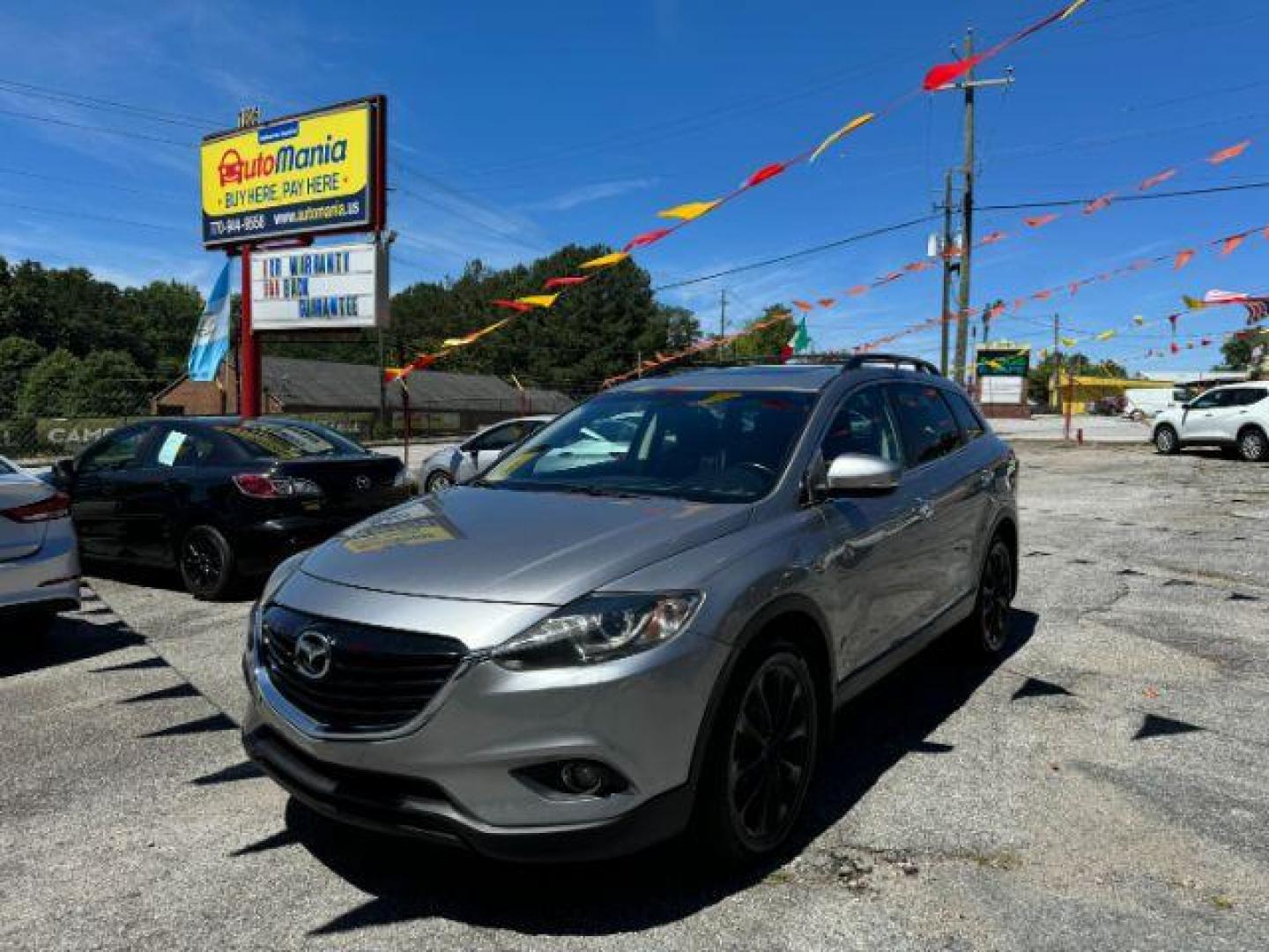 2015 Silver Mazda CX-9 Grand Touring (JM3TB2DAXF0) with an 3.7L V6 DOHC 24V engine, 6-Speed Automatic transmission, located at 1806 Veterans Memorial Hwy SW, Austell, GA, 30168, (770) 944-9558, 33.817959, -84.606987 - Photo#1