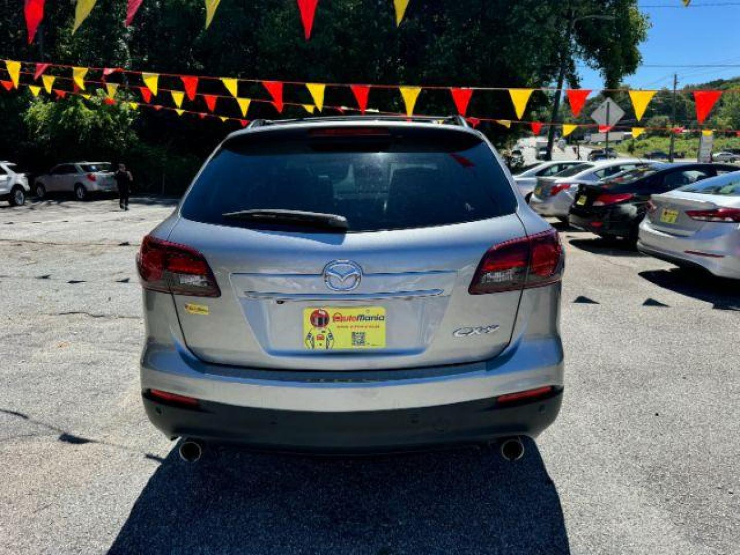 2015 Silver Mazda CX-9 Grand Touring (JM3TB2DAXF0) with an 3.7L V6 DOHC 24V engine, 6-Speed Automatic transmission, located at 1806 Veterans Memorial Hwy SW, Austell, GA, 30168, (770) 944-9558, 33.817959, -84.606987 - Photo#5