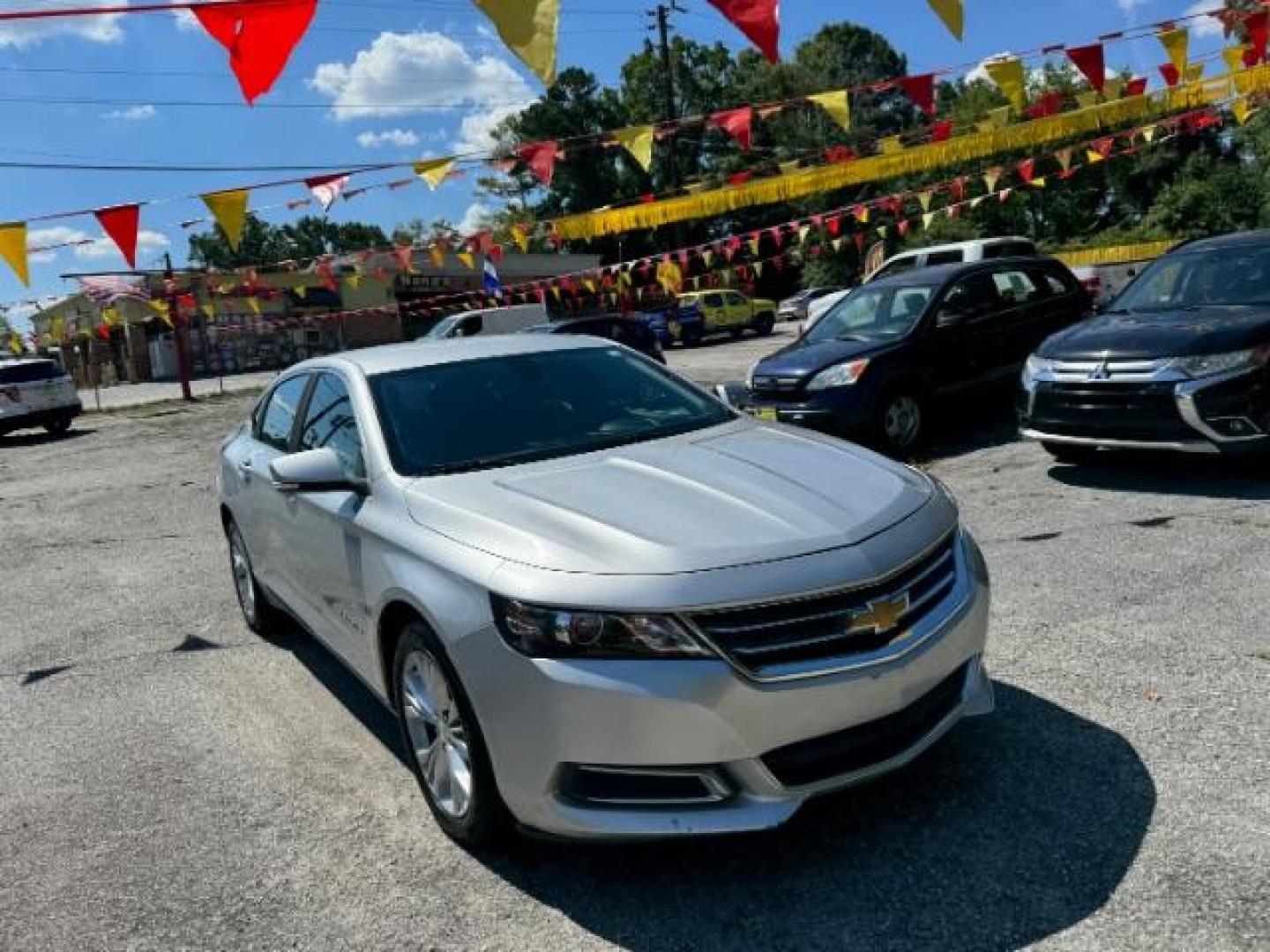 2014 Silver Chevrolet Impala 1LT (2G1115SL5E9) with an 2.5L L4 DOHC 16V engine, 6-Speed Automatic transmission, located at 1806 Veterans Memorial Hwy SW, Austell, GA, 30168, (770) 944-9558, 33.817959, -84.606987 - Photo#2