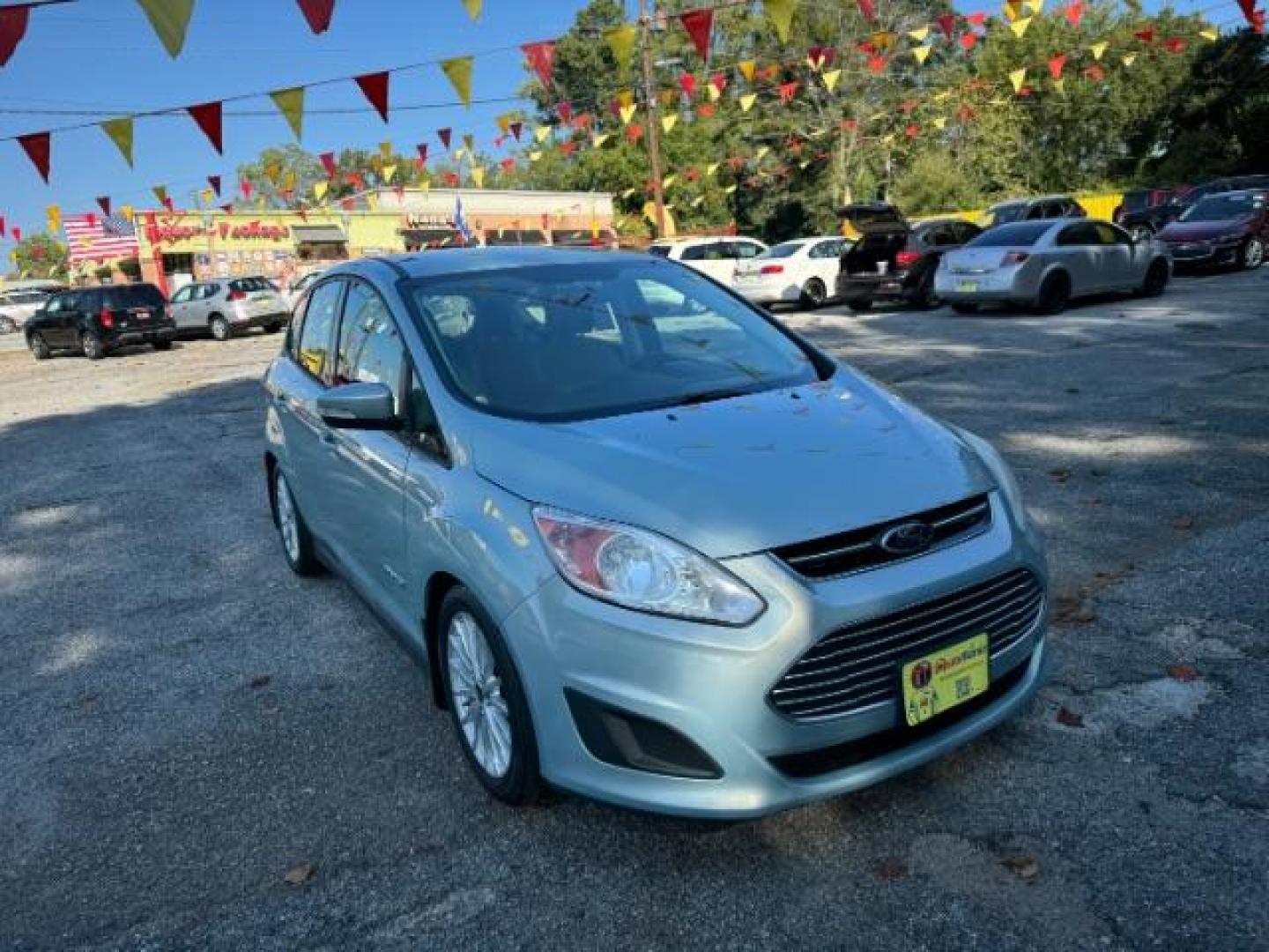 2013 Blue Ford C-Max Hybrid SE (1FADP5AU2DL) with an 2.0L L4 DOHC 16V HYBRID engine, Continuously Variable Transmission transmission, located at 1806 Veterans Memorial Hwy SW, Austell, GA, 30168, (770) 944-9558, 33.817959, -84.606987 - Photo#1