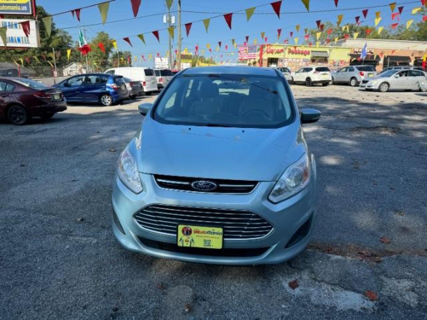 2013 Blue Ford C-Max Hybrid SE (1FADP5AU2DL) with an 2.0L L4 DOHC 16V HYBRID engine, Continuously Variable Transmission transmission, located at 1806 Veterans Memorial Hwy SW, Austell, GA, 30168, (770) 944-9558, 33.817959, -84.606987 - Photo#2