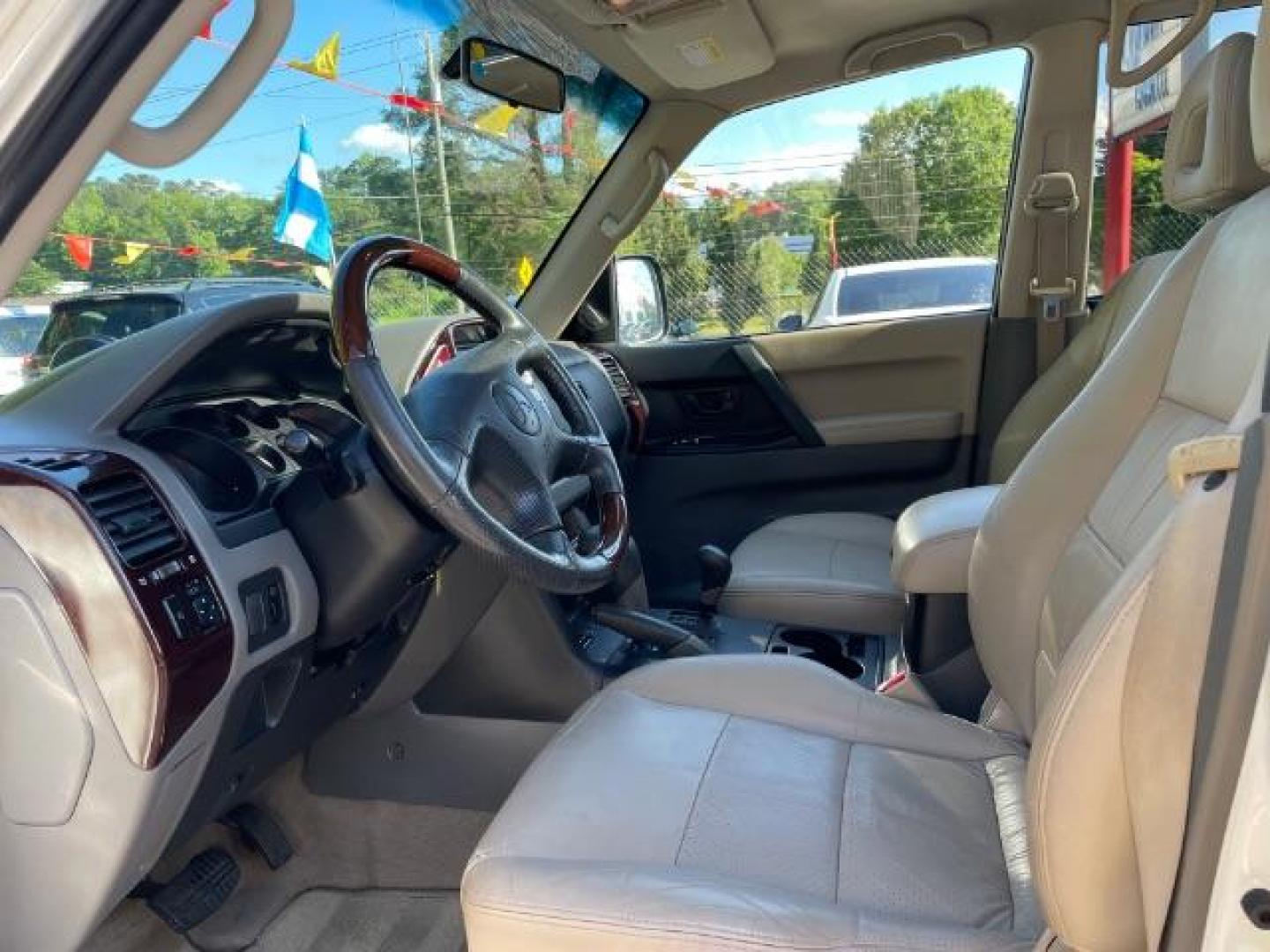 2002 White Mitsubishi Montero SPORT UTILITY 4-DR (JA4MW51R42J) with an 3.5L V6 SOHC 24V engine, 5-Speed Automatic transmission, located at 1806 Veterans Memorial Hwy SW, Austell, GA, 30168, (770) 944-9558, 33.817959, -84.606987 - Photo#9