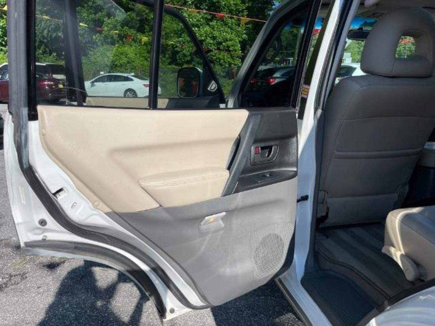 2002 White Mitsubishi Montero SPORT UTILITY 4-DR (JA4MW51R42J) with an 3.5L V6 SOHC 24V engine, 5-Speed Automatic transmission, located at 1806 Veterans Memorial Hwy SW, Austell, GA, 30168, (770) 944-9558, 33.817959, -84.606987 - Photo#12