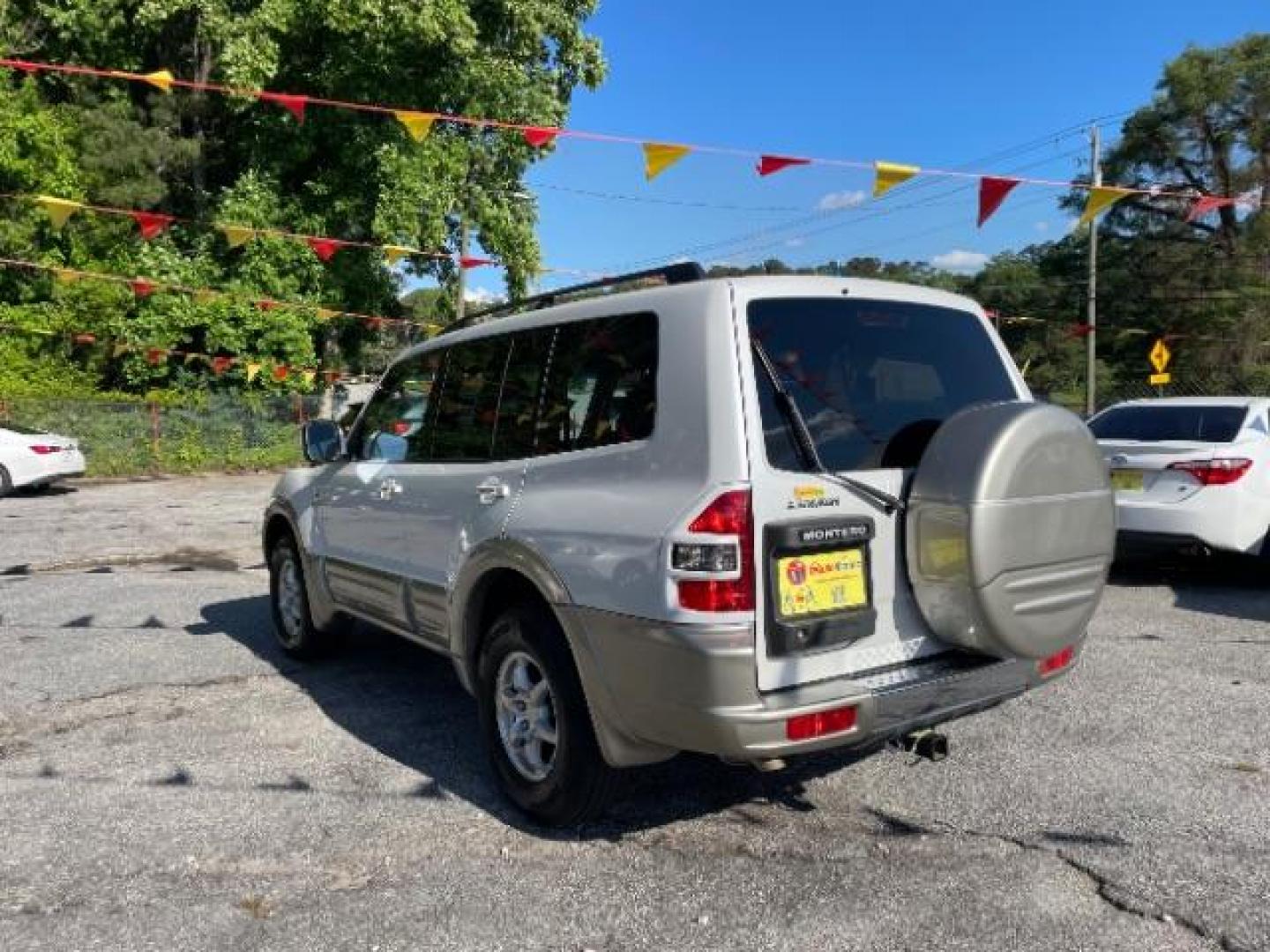 2002 White Mitsubishi Montero SPORT UTILITY 4-DR (JA4MW51R42J) with an 3.5L V6 SOHC 24V engine, 5-Speed Automatic transmission, located at 1806 Veterans Memorial Hwy SW, Austell, GA, 30168, (770) 944-9558, 33.817959, -84.606987 - Photo#18