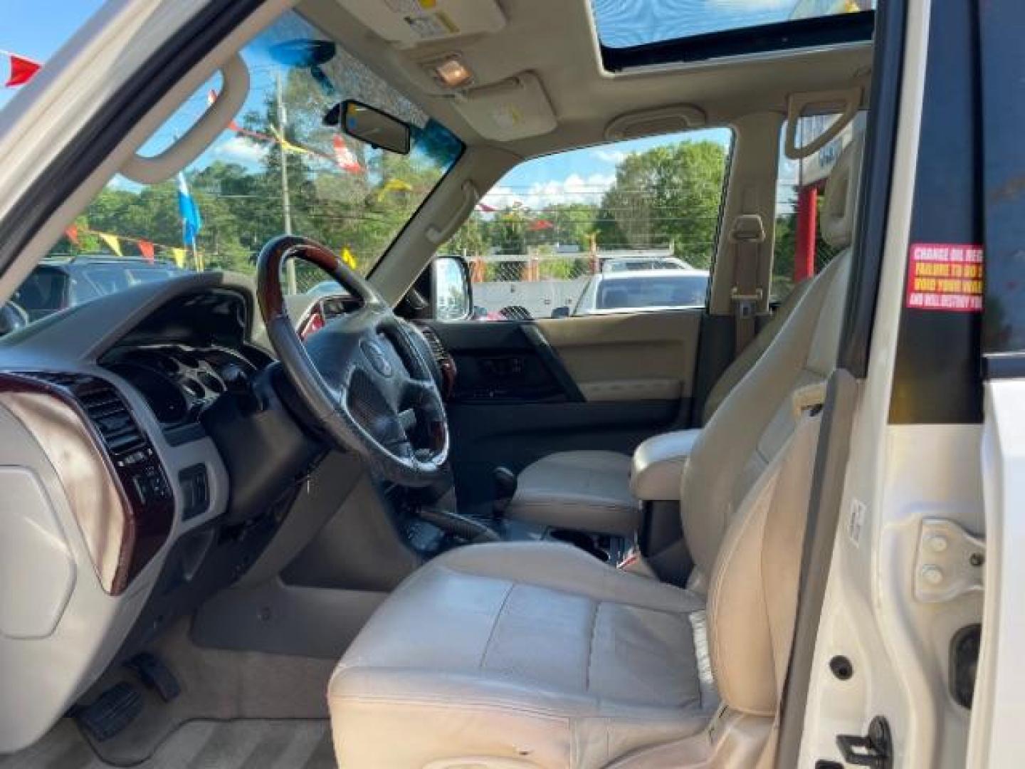 2002 White Mitsubishi Montero SPORT UTILITY 4-DR (JA4MW51R42J) with an 3.5L V6 SOHC 24V engine, 5-Speed Automatic transmission, located at 1806 Veterans Memorial Hwy SW, Austell, GA, 30168, (770) 944-9558, 33.817959, -84.606987 - Photo#21