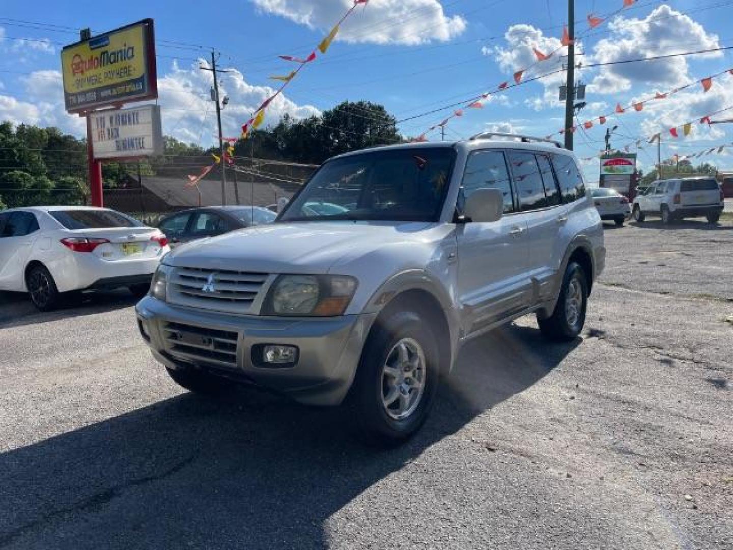 2002 White Mitsubishi Montero SPORT UTILITY 4-DR (JA4MW51R42J) with an 3.5L V6 SOHC 24V engine, 5-Speed Automatic transmission, located at 1806 Veterans Memorial Hwy SW, Austell, GA, 30168, (770) 944-9558, 33.817959, -84.606987 - Photo#1