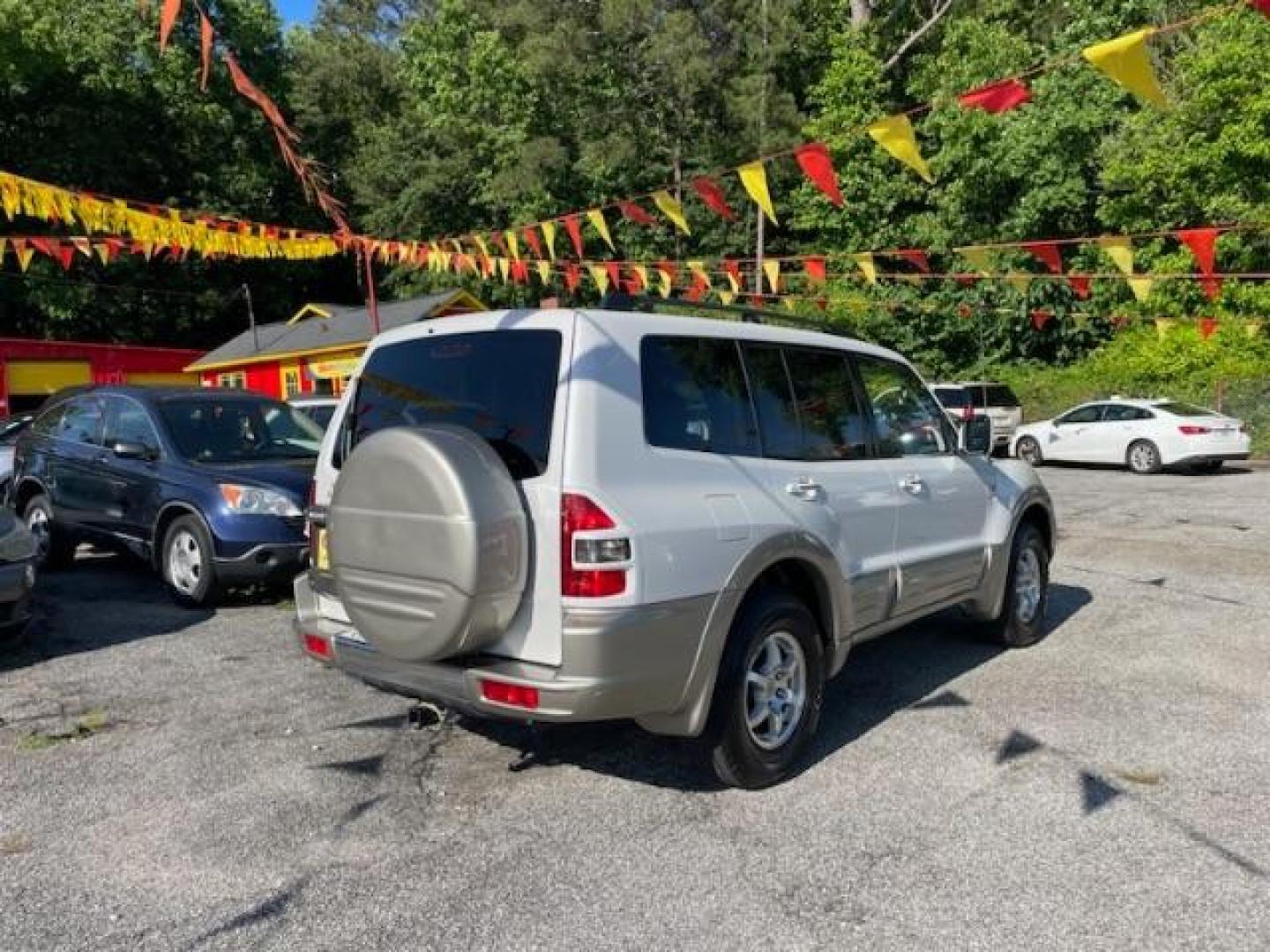 2002 White Mitsubishi Montero SPORT UTILITY 4-DR (JA4MW51R42J) with an 3.5L V6 SOHC 24V engine, 5-Speed Automatic transmission, located at 1806 Veterans Memorial Hwy SW, Austell, GA, 30168, (770) 944-9558, 33.817959, -84.606987 - Photo#19