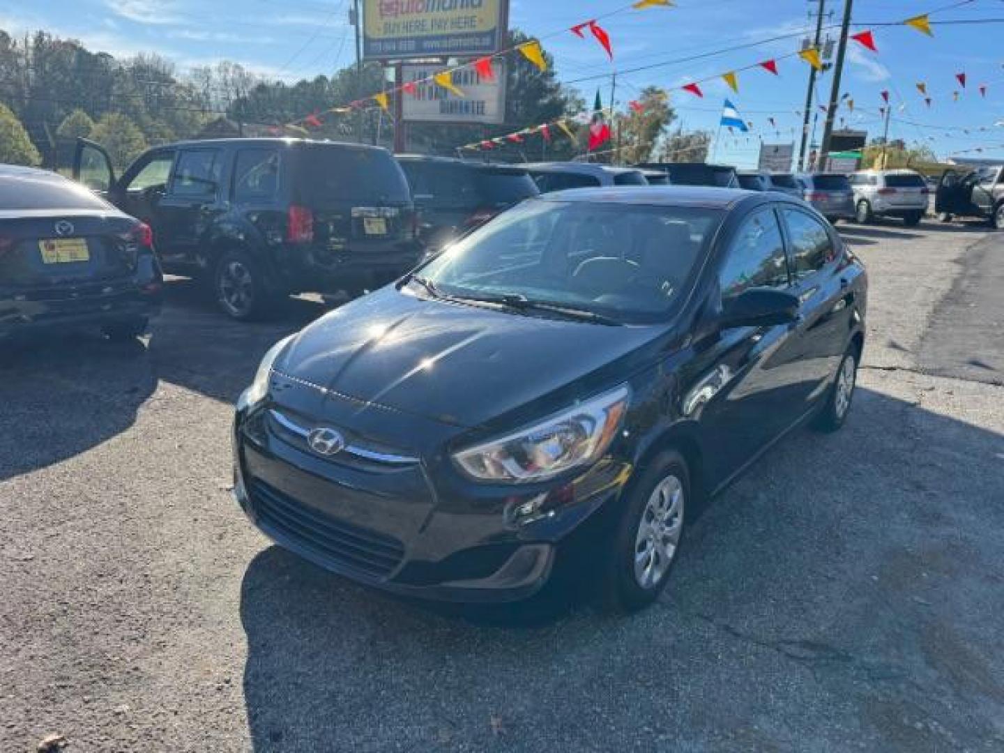 2017 Black Hyundai Accent SE 4-Door 6A (KMHCT4AE7HU) with an 1.6L L4 DOHC 16V engine, 6-Speed Automatic transmission, located at 1806 Veterans Memorial Hwy SW, Austell, GA, 30168, (770) 944-9558, 33.817959, -84.606987 - Photo#0