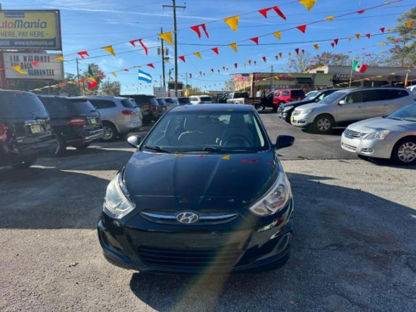 2017 Black Hyundai Accent SE 4-Door 6A (KMHCT4AE7HU) with an 1.6L L4 DOHC 16V engine, 6-Speed Automatic transmission, located at 1806 Veterans Memorial Hwy SW, Austell, GA, 30168, (770) 944-9558, 33.817959, -84.606987 - Photo#2