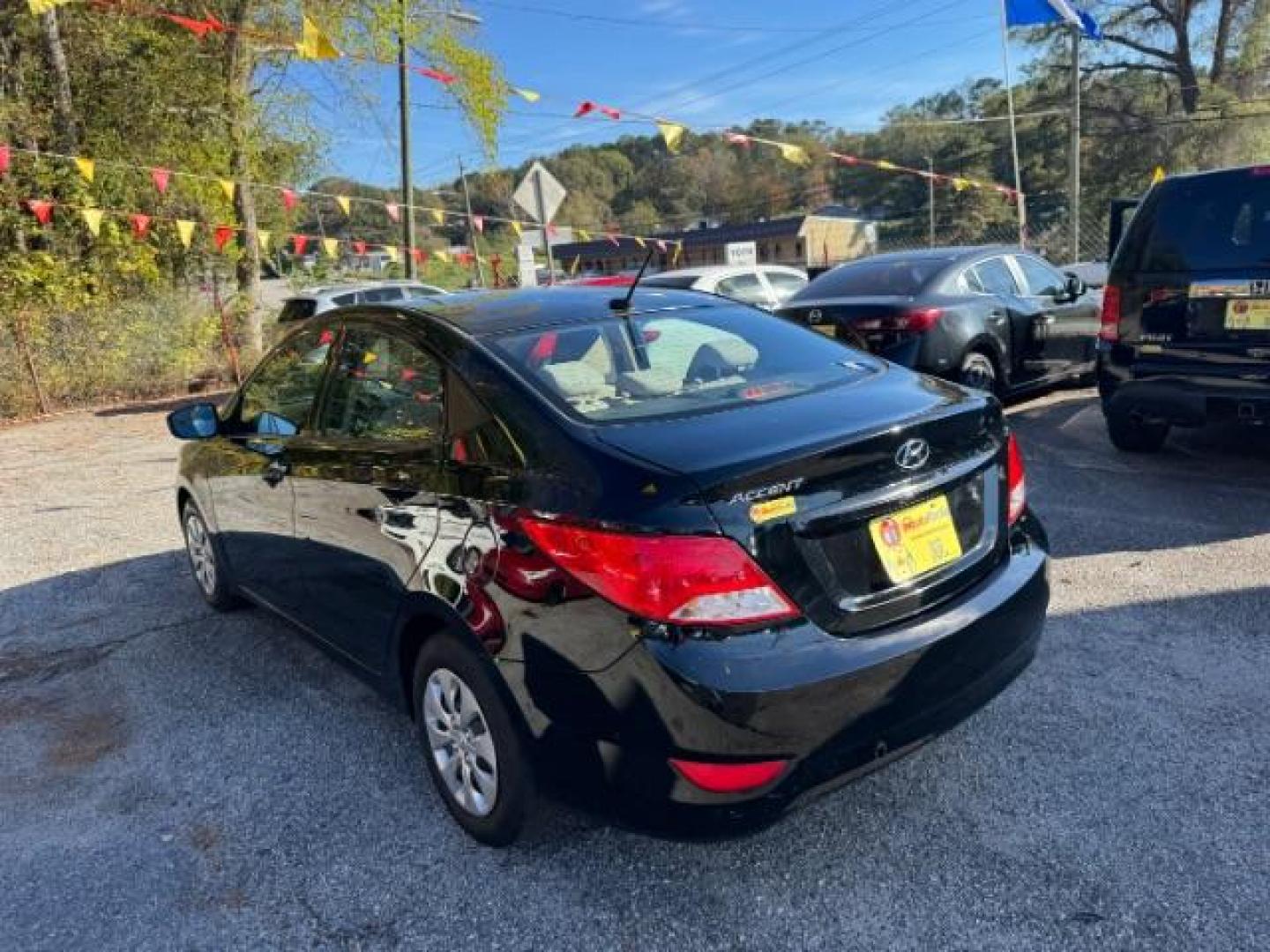 2017 Black Hyundai Accent SE 4-Door 6A (KMHCT4AE7HU) with an 1.6L L4 DOHC 16V engine, 6-Speed Automatic transmission, located at 1806 Veterans Memorial Hwy SW, Austell, GA, 30168, (770) 944-9558, 33.817959, -84.606987 - Photo#4