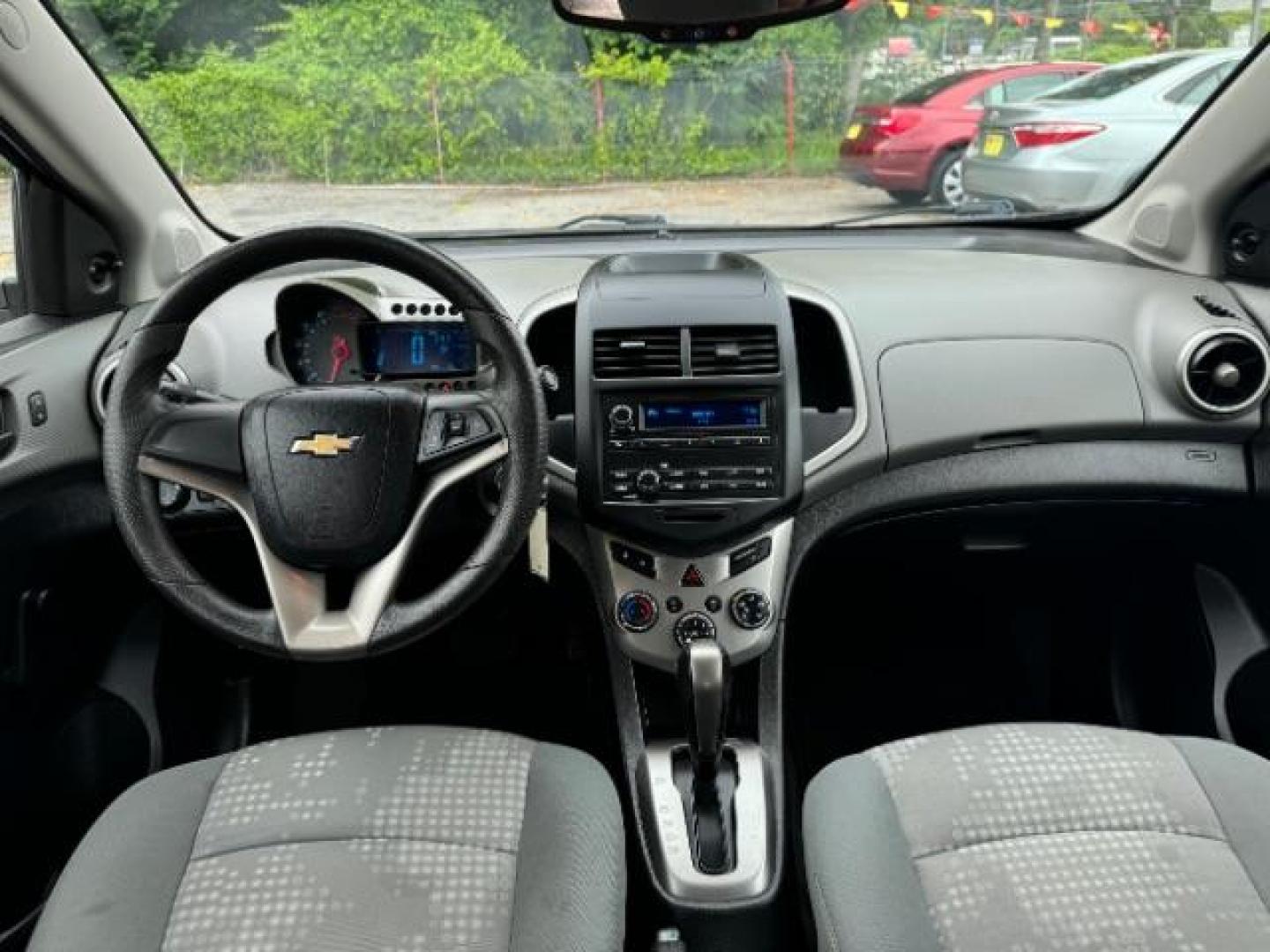 2015 Silver Chevrolet Sonic LS Auto Sedan (1G1JA5SH0F4) with an 1.8L L4 DOHC 24V engine, 6-Speed Automatic transmission, located at 1806 Veterans Memorial Hwy SW, Austell, GA, 30168, (770) 944-9558, 33.817959, -84.606987 - Photo#10