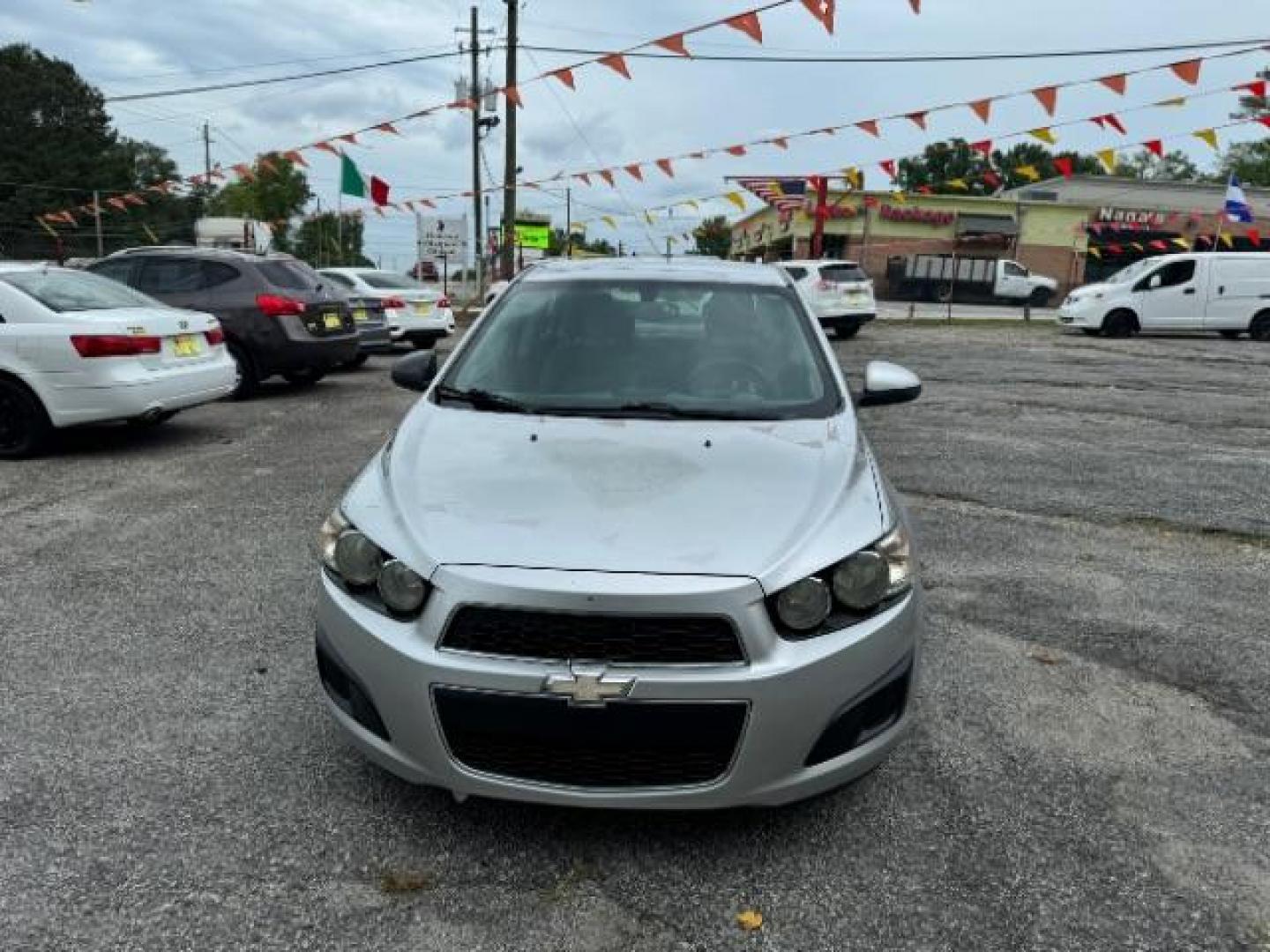 2015 Silver Chevrolet Sonic LS Auto Sedan (1G1JA5SH0F4) with an 1.8L L4 DOHC 24V engine, 6-Speed Automatic transmission, located at 1806 Veterans Memorial Hwy SW, Austell, GA, 30168, (770) 944-9558, 33.817959, -84.606987 - Photo#1