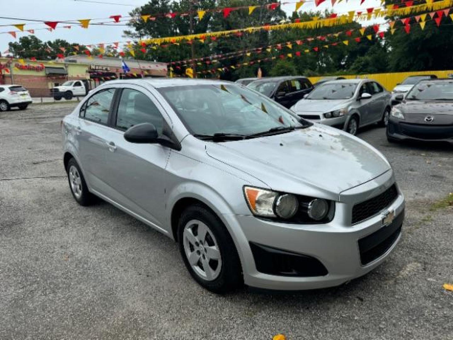 2015 Silver Chevrolet Sonic LS Auto Sedan (1G1JA5SH0F4) with an 1.8L L4 DOHC 24V engine, 6-Speed Automatic transmission, located at 1806 Veterans Memorial Hwy SW, Austell, GA, 30168, (770) 944-9558, 33.817959, -84.606987 - Photo#2
