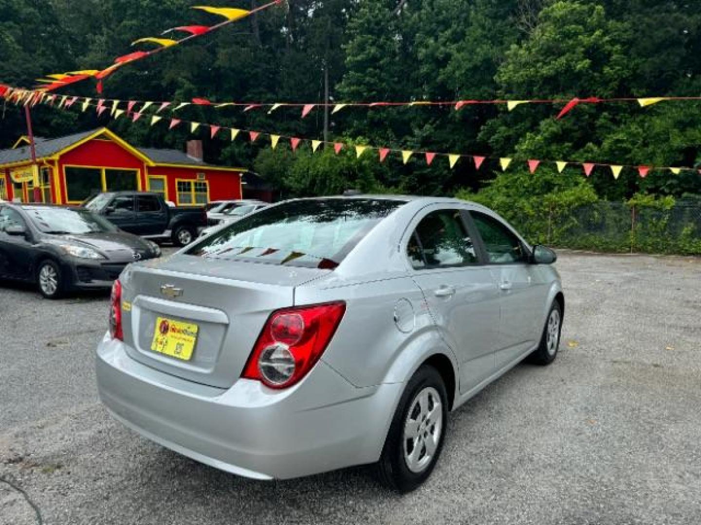 2015 Silver Chevrolet Sonic LS Auto Sedan (1G1JA5SH0F4) with an 1.8L L4 DOHC 24V engine, 6-Speed Automatic transmission, located at 1806 Veterans Memorial Hwy SW, Austell, GA, 30168, (770) 944-9558, 33.817959, -84.606987 - Photo#3