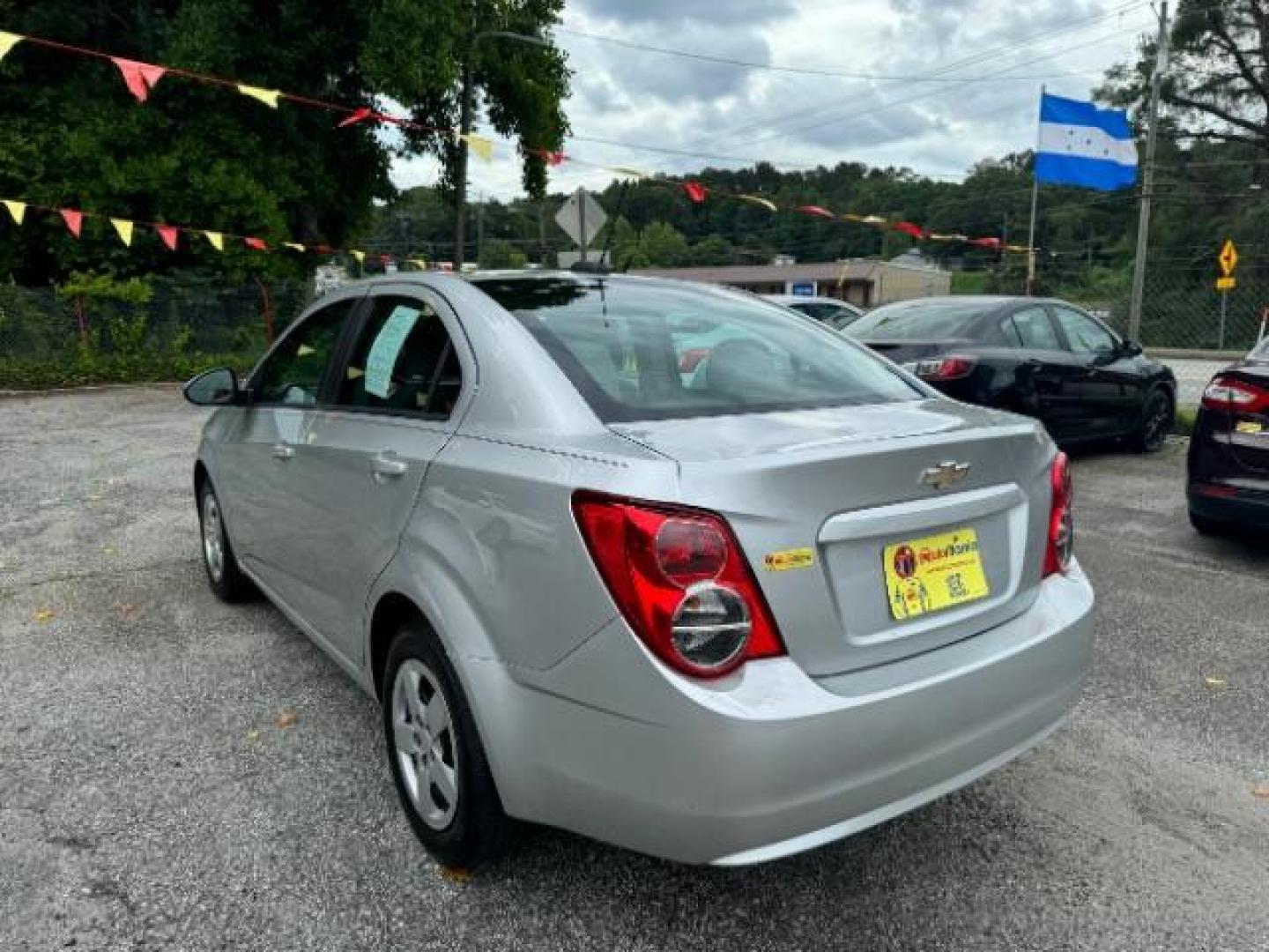 2015 Silver Chevrolet Sonic LS Auto Sedan (1G1JA5SH0F4) with an 1.8L L4 DOHC 24V engine, 6-Speed Automatic transmission, located at 1806 Veterans Memorial Hwy SW, Austell, GA, 30168, (770) 944-9558, 33.817959, -84.606987 - Photo#5