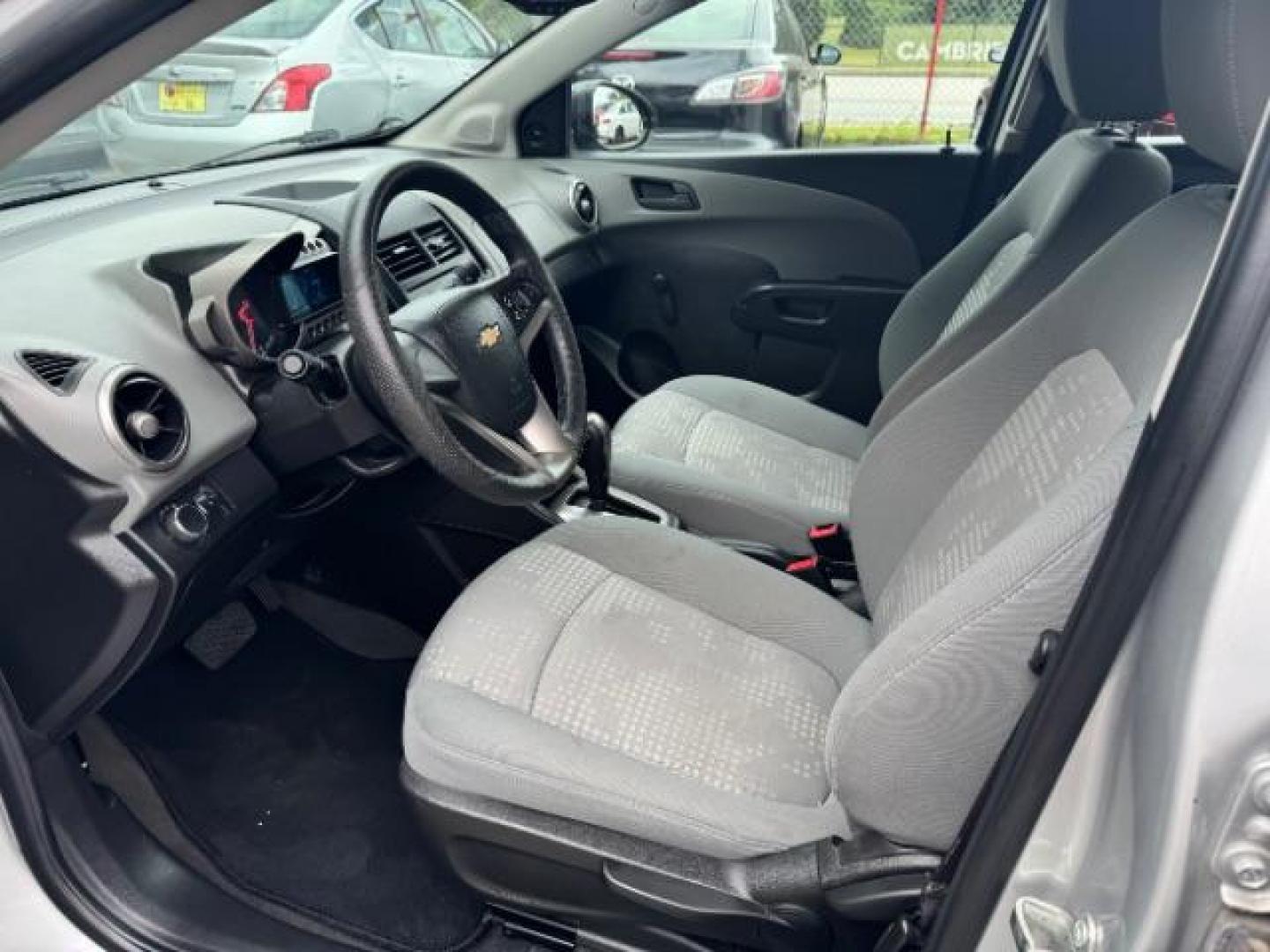 2015 Silver Chevrolet Sonic LS Auto Sedan (1G1JA5SH0F4) with an 1.8L L4 DOHC 24V engine, 6-Speed Automatic transmission, located at 1806 Veterans Memorial Hwy SW, Austell, GA, 30168, (770) 944-9558, 33.817959, -84.606987 - Photo#6