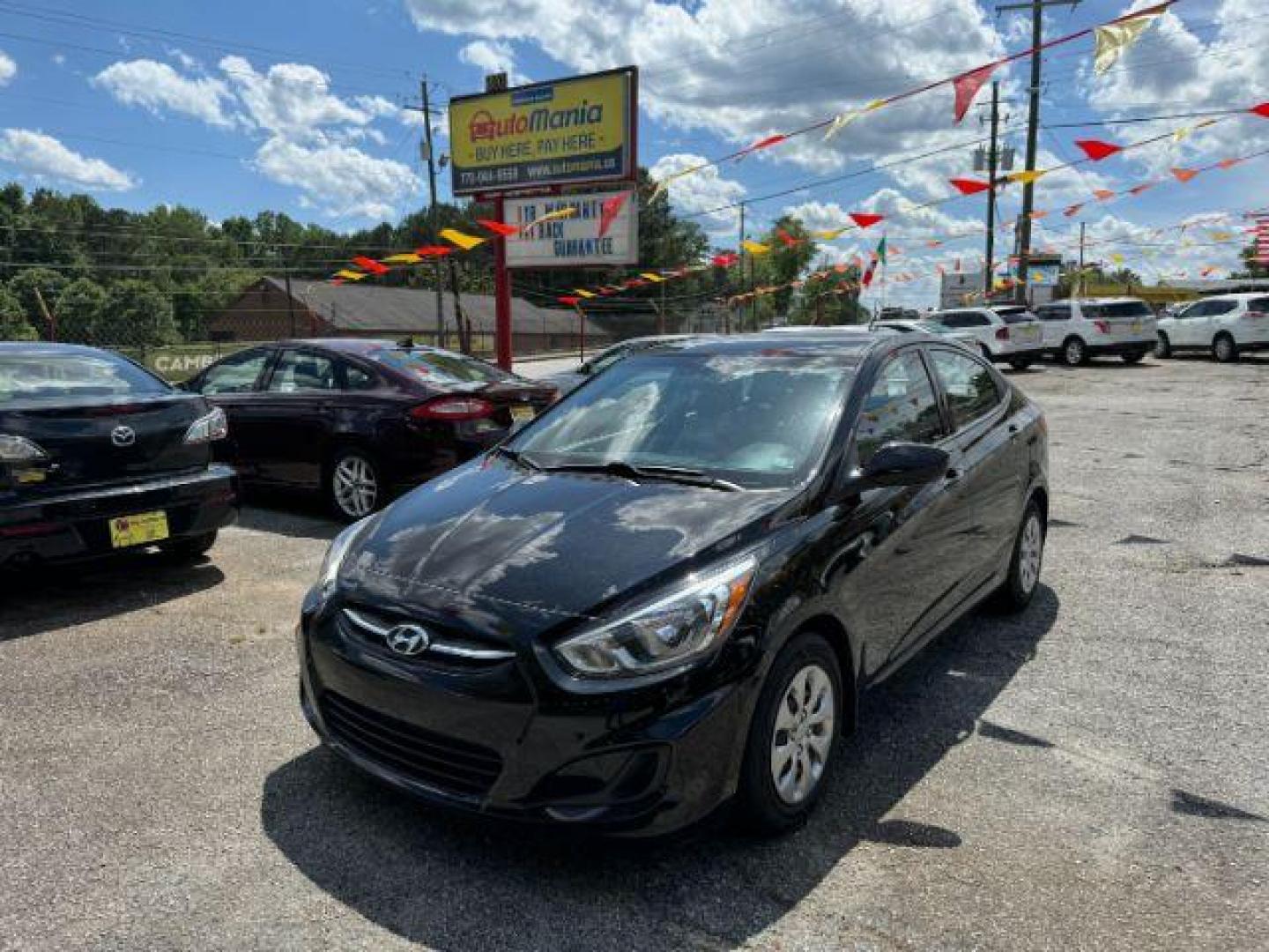 2016 Black Hyundai Accent SE 4-Door 6A (KMHCT4AE5GU) with an 1.6L L4 DOHC 16V engine, 6-Speed Automatic transmission, located at 1806 Veterans Memorial Hwy SW, Austell, GA, 30168, (770) 944-9558, 33.817959, -84.606987 - Photo#0