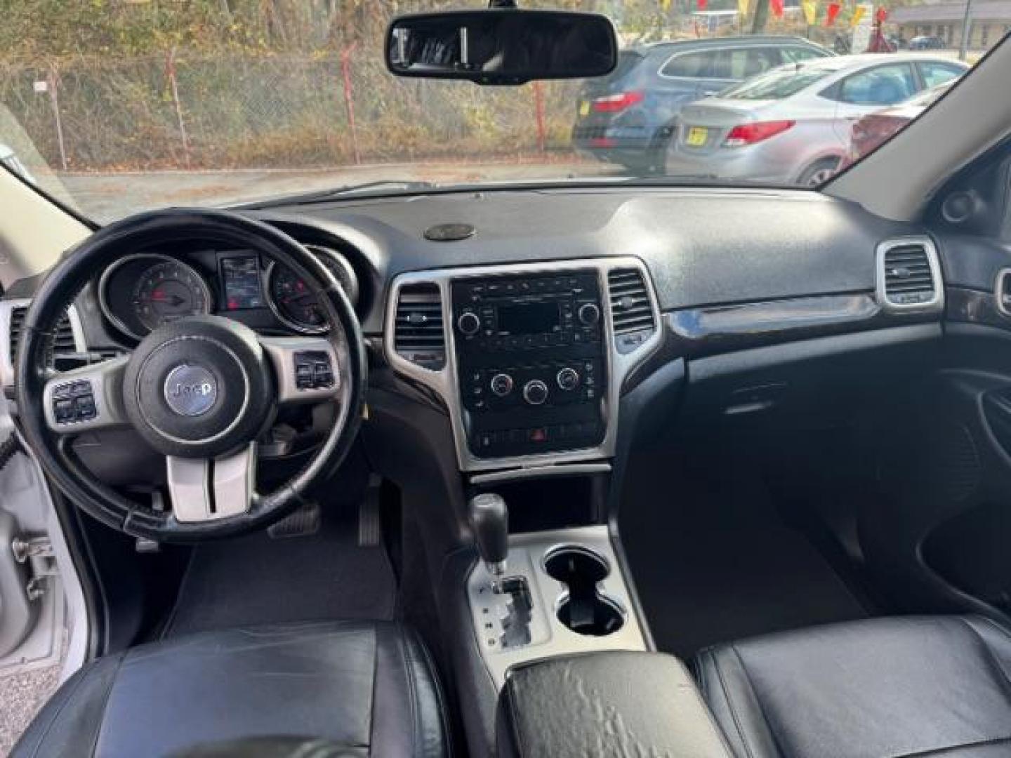 2012 Silver Jeep Grand Cherokee Laredo 2WD (1C4RJEAG6CC) with an 3.6L V6 DOHC 24V engine, 5-Speed Automatic transmission, located at 1806 Veterans Memorial Hwy SW, Austell, GA, 30168, (770) 944-9558, 33.817959, -84.606987 - Photo#11